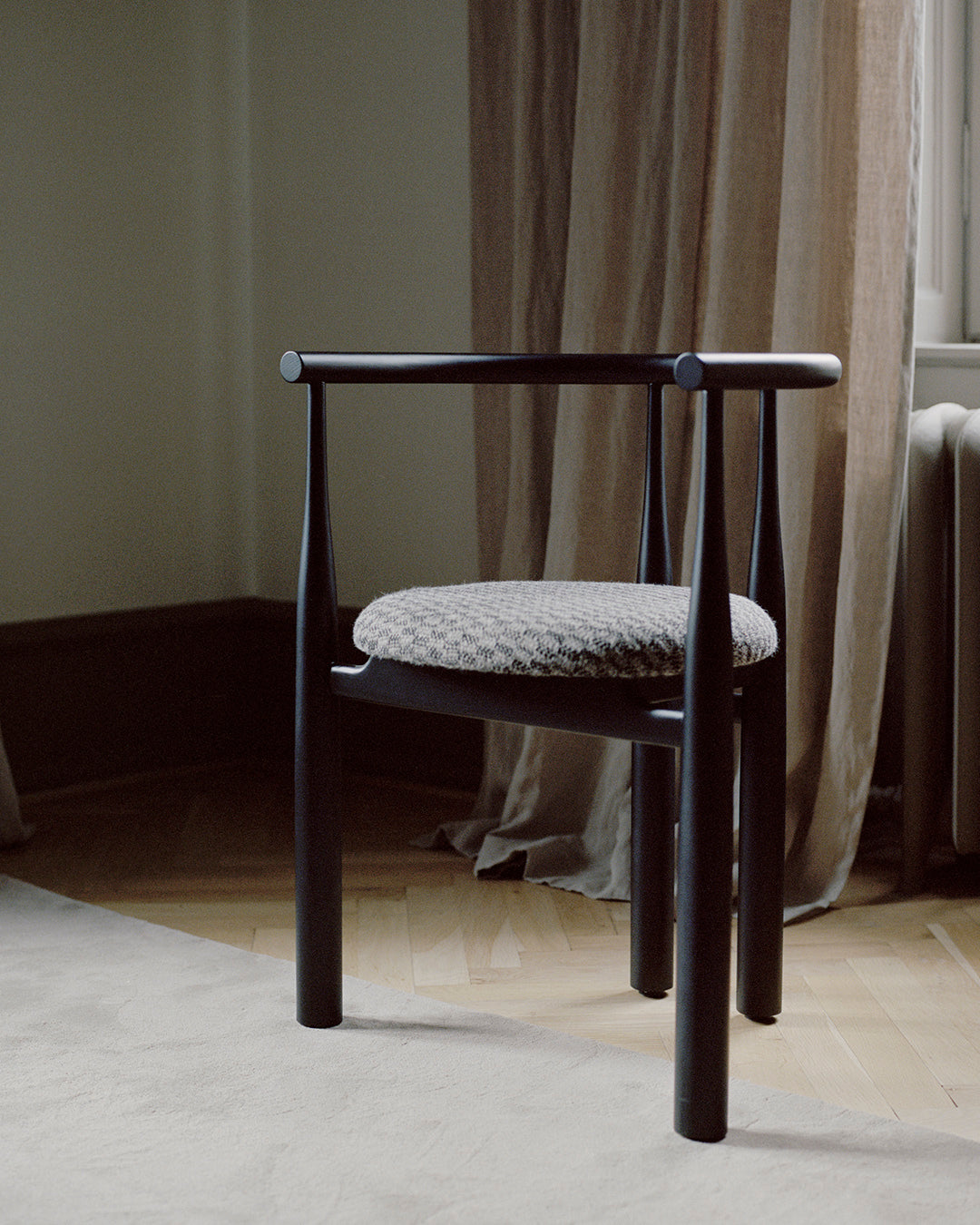 Bukowski chair upholstered with a black beech base