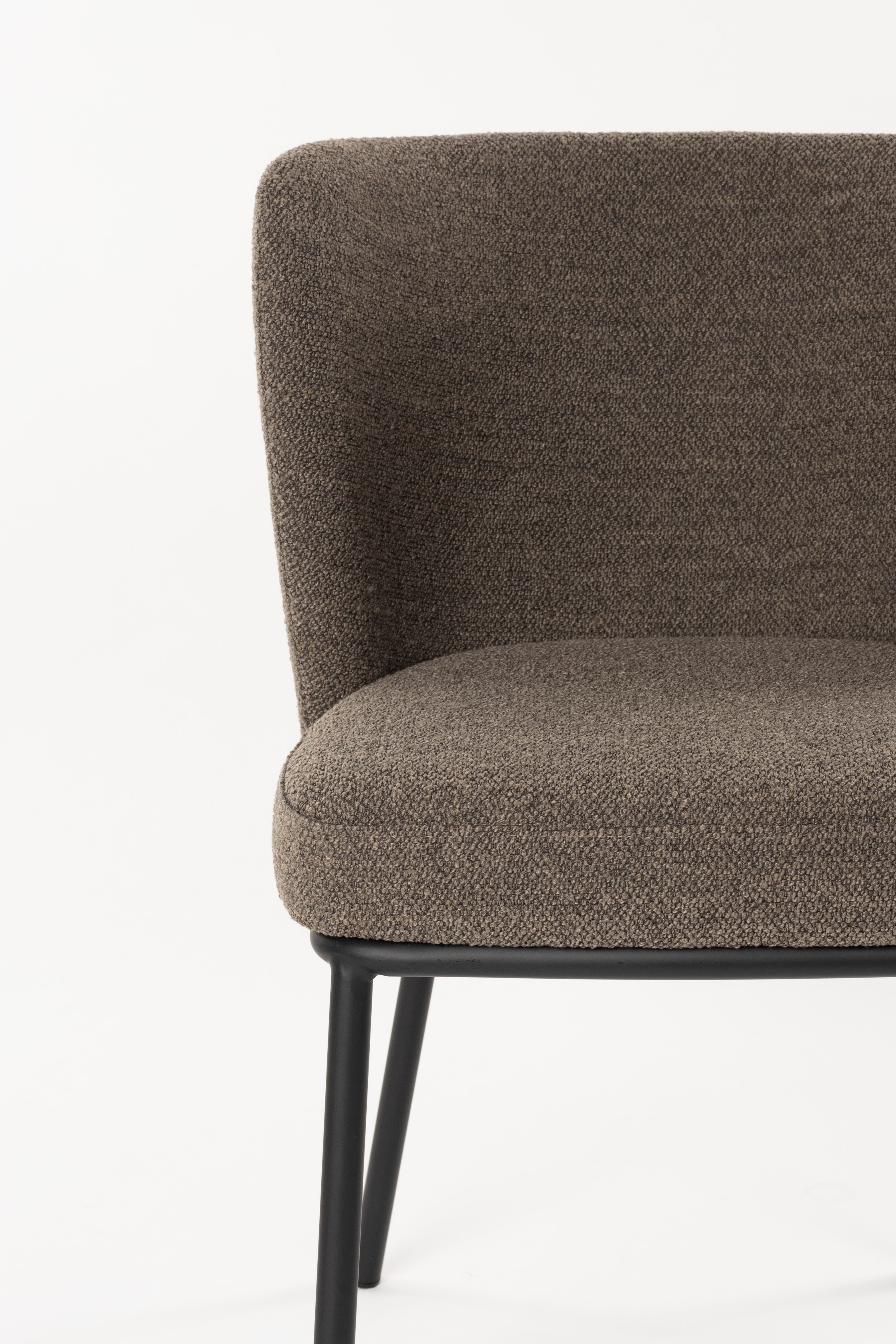Brown guus chair with a black base