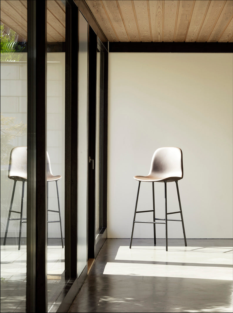 Bar chair upholstered forms with a light gray base