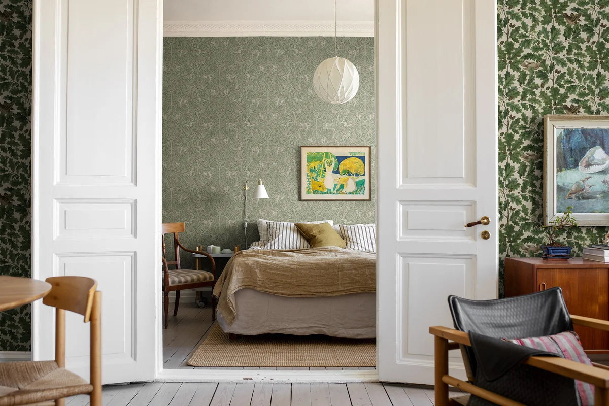 Wallpaper with a botanical pattern and forest theme UNDER THE ELDER TREE green with white