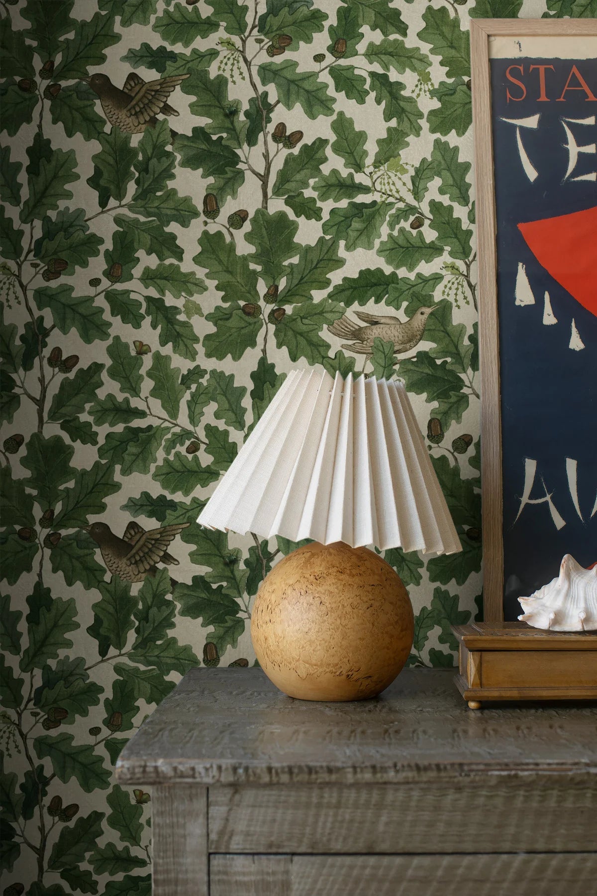 Wallpaper with a plant motif of leaves and birds IN THE OAK green with white