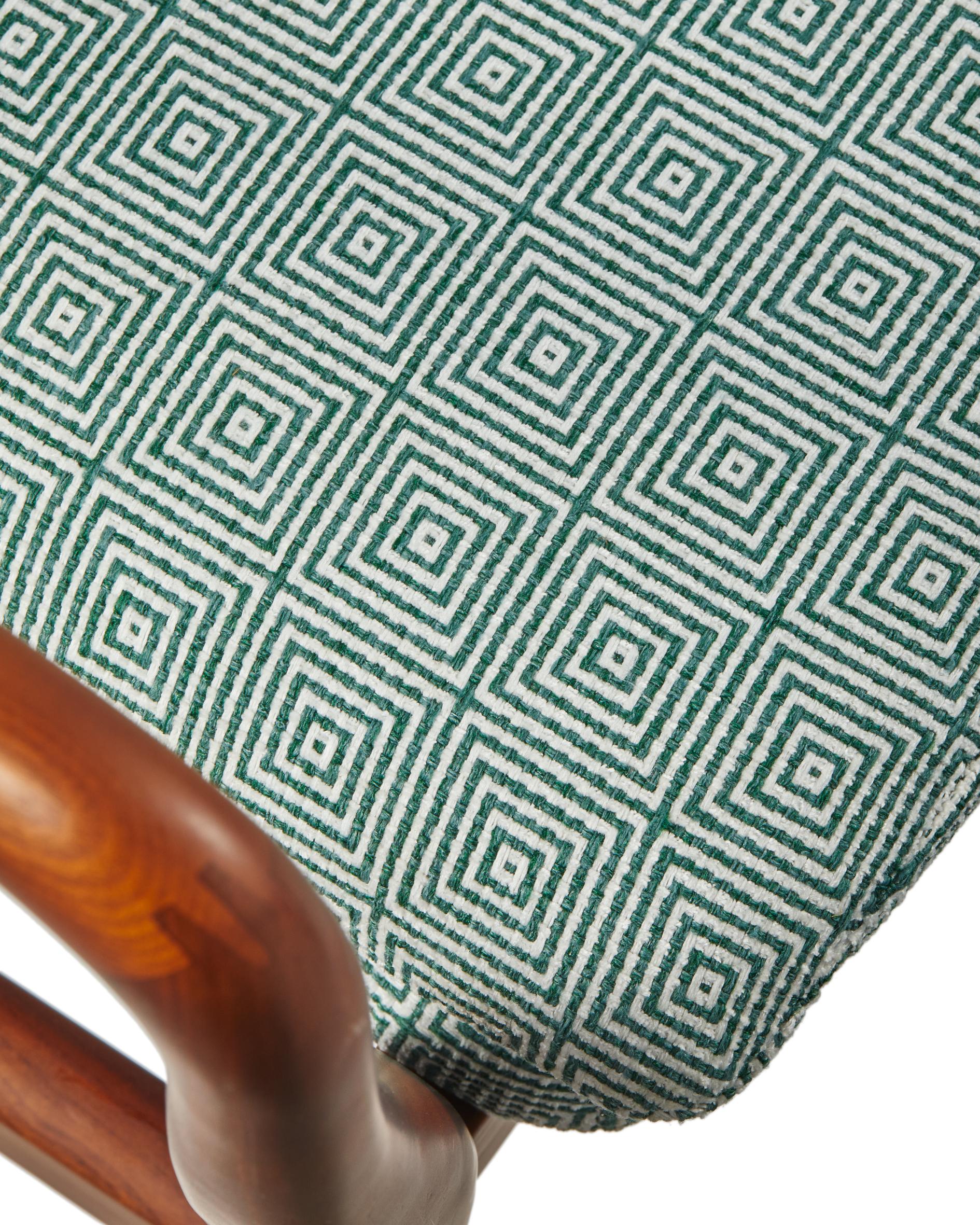 PEGGY armchair in green with geometric patterns and a wooden base