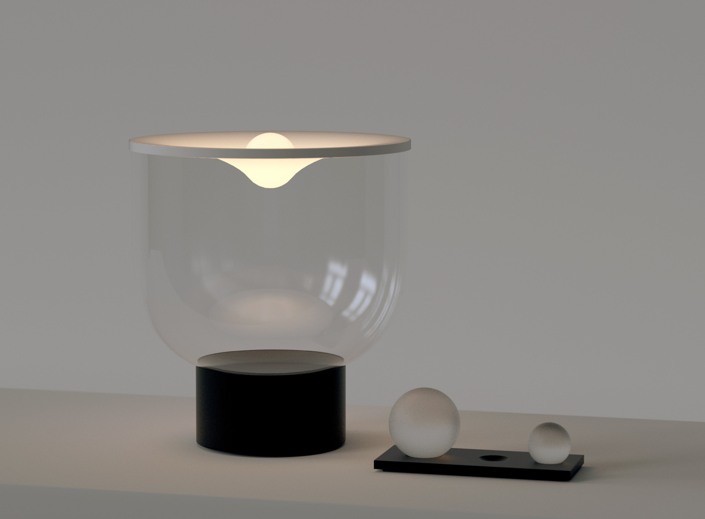 GRAMMOLUCE table lamp with a glass shade and black base.