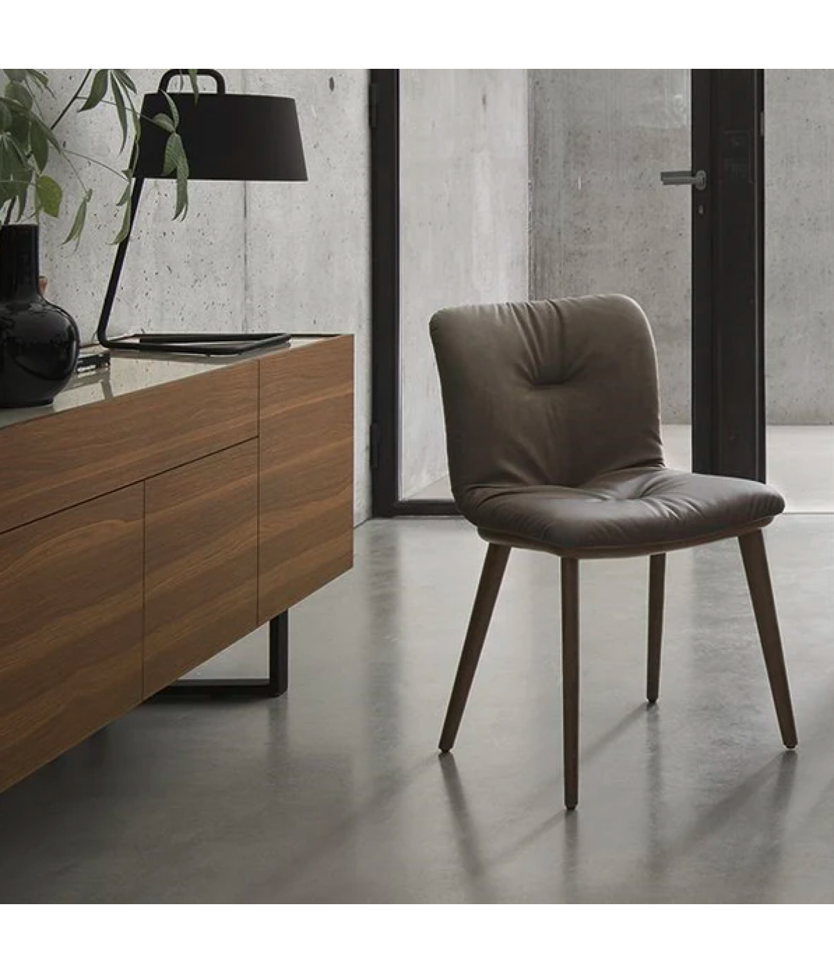 ANNIE SOFT upholstered chair with a black wooden base