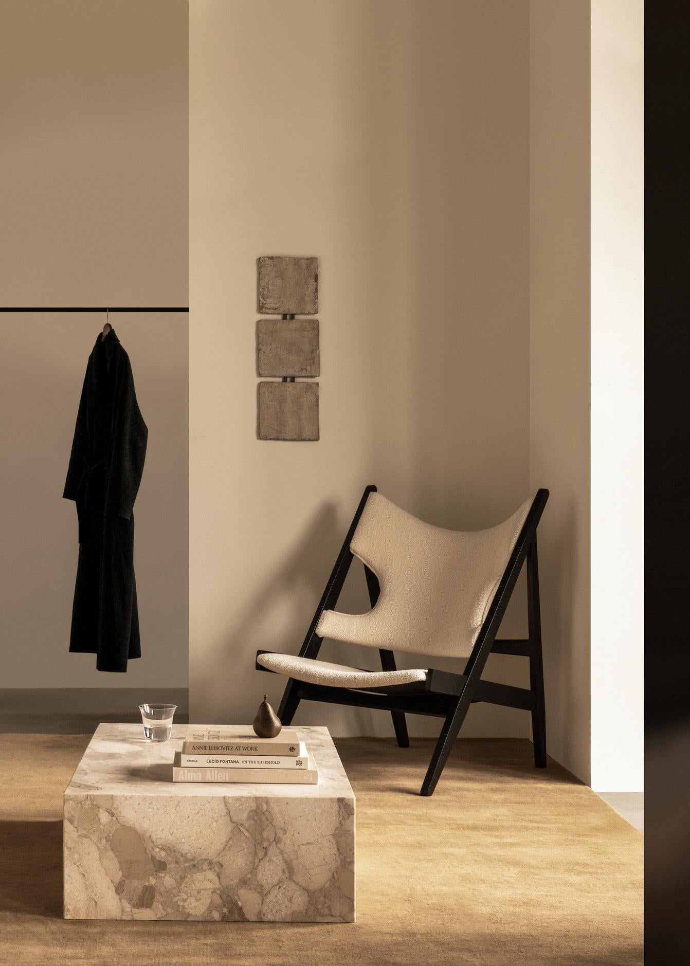 KNITTING cream armchair with walnut base