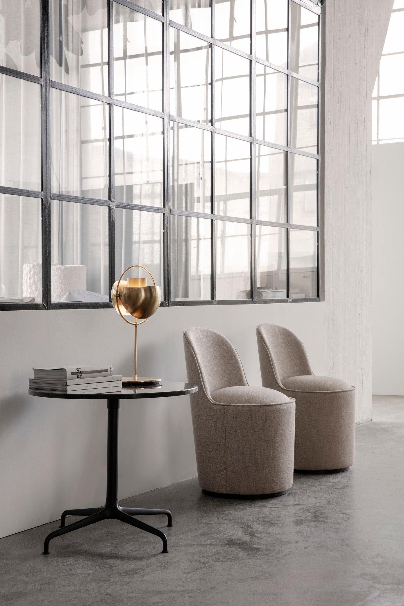 Upholstered TAIL armchair with a brass base