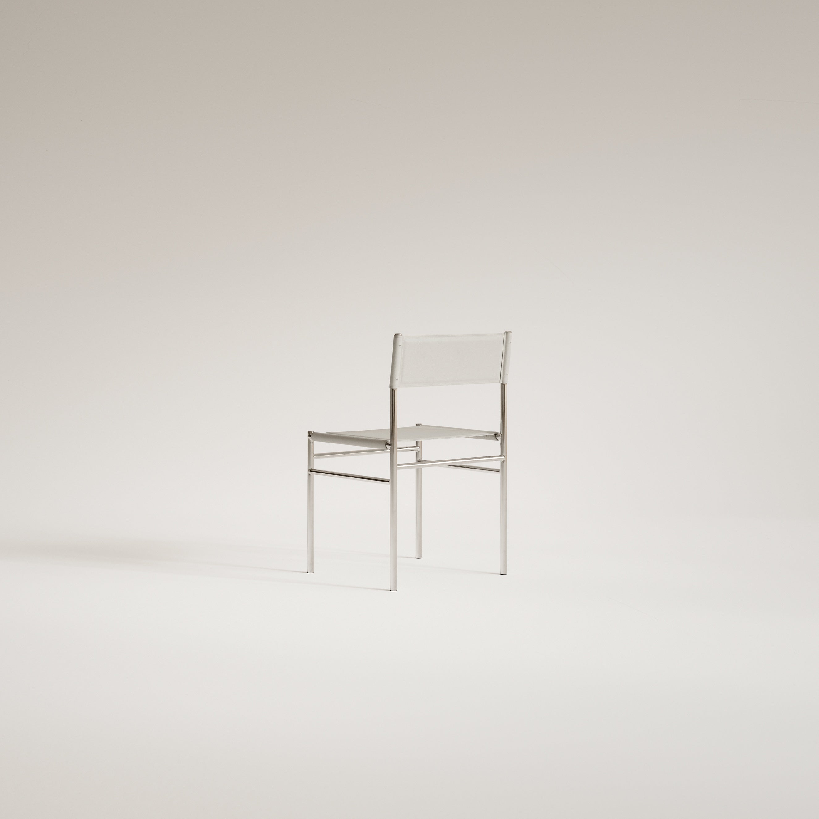 Stolička FERRA z ocele a kože