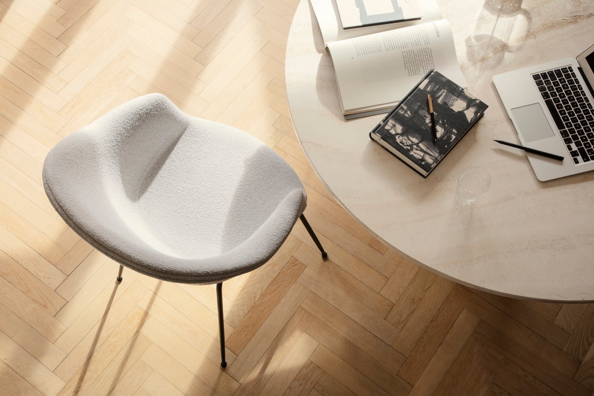 Upholstered BAT chair with a brass base