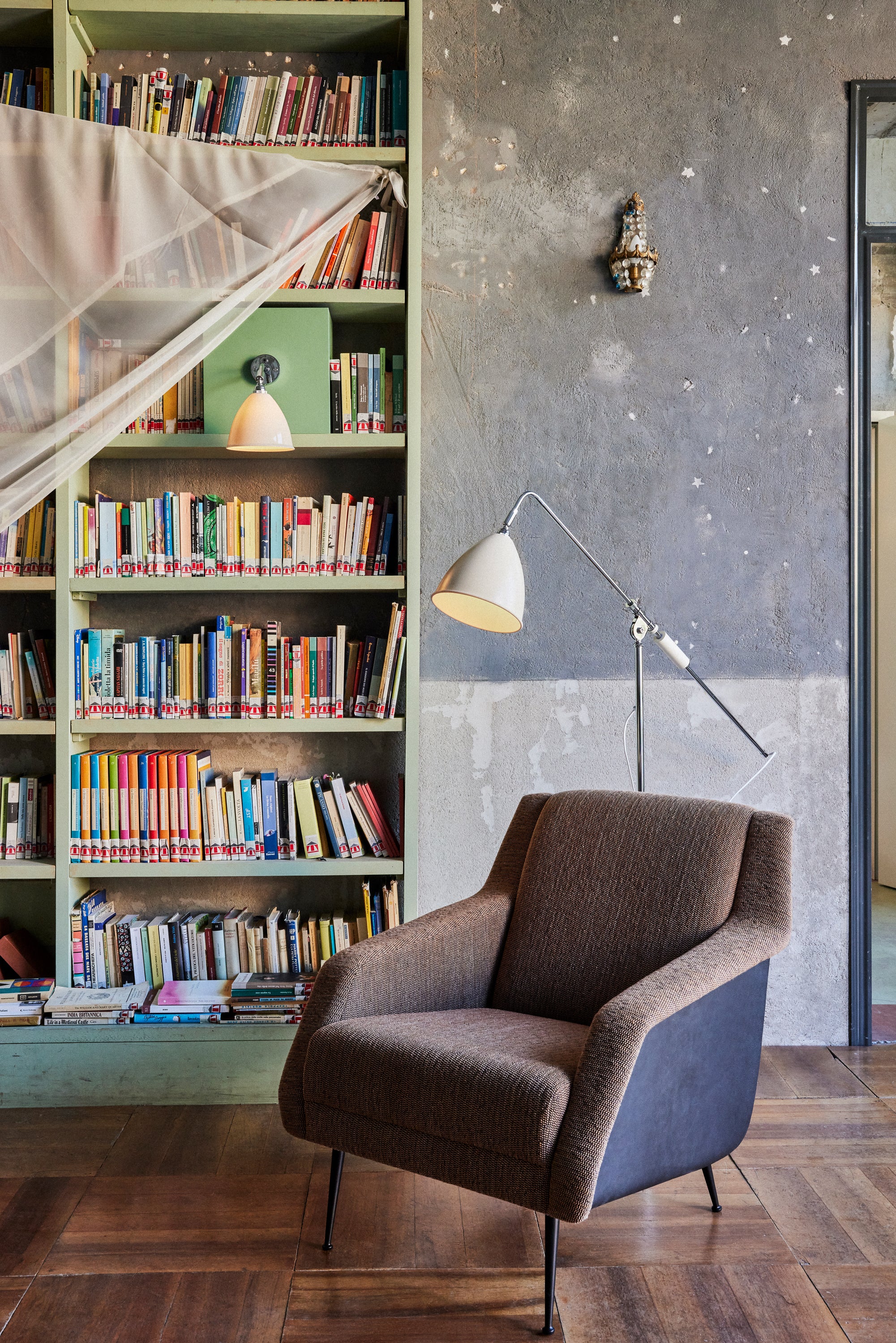 CDC.1 upholstered armchair with a brass base