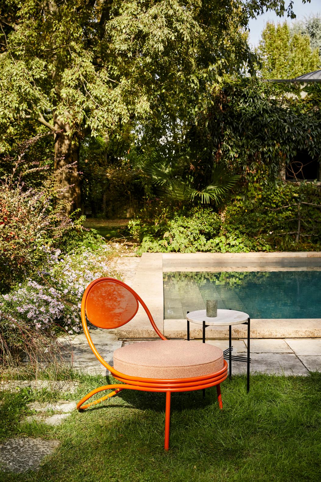COPACABANA armchair upholstered with an orange base