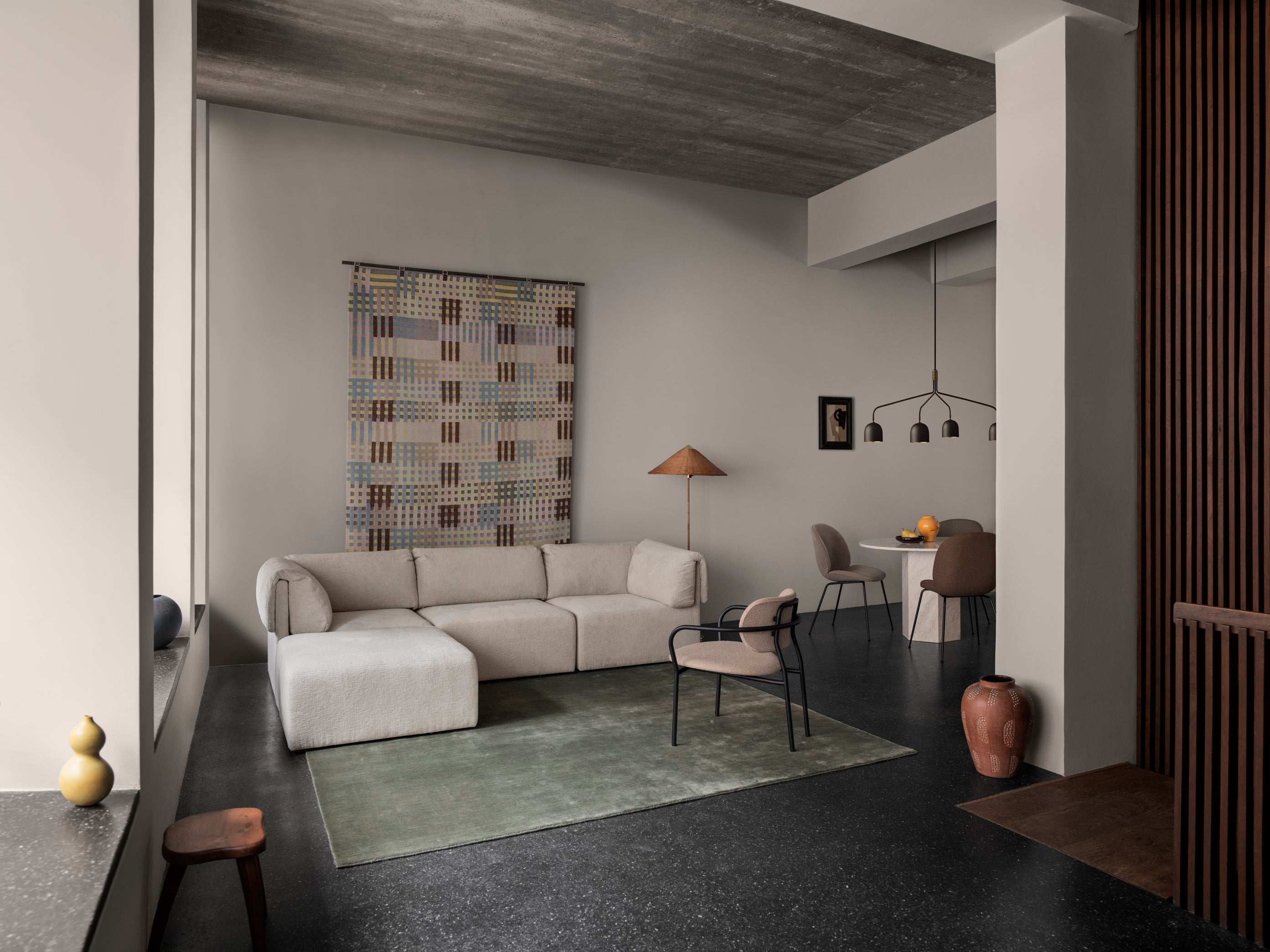 COCO upholstered armchair with a black base