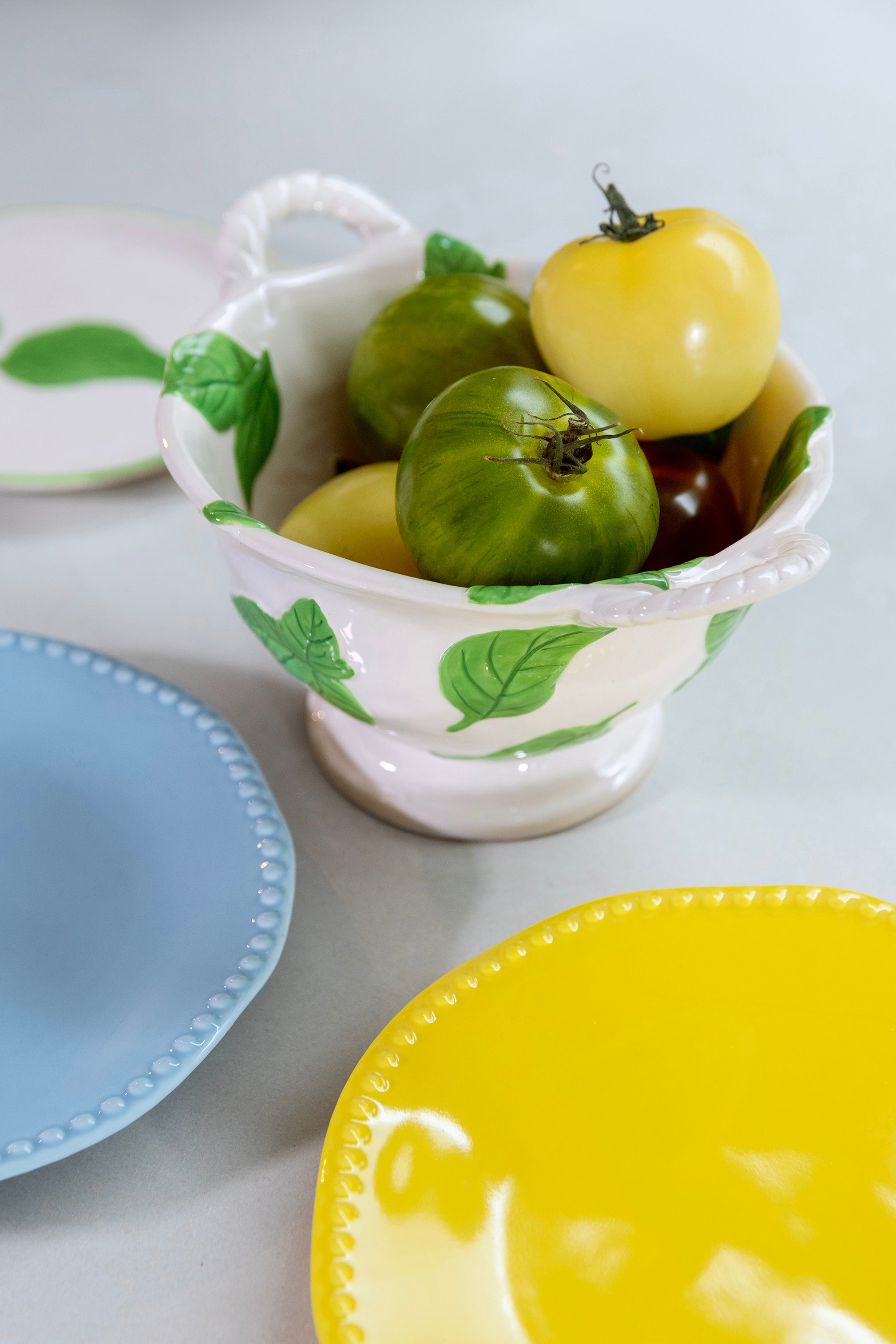 White BASIL colander with green base