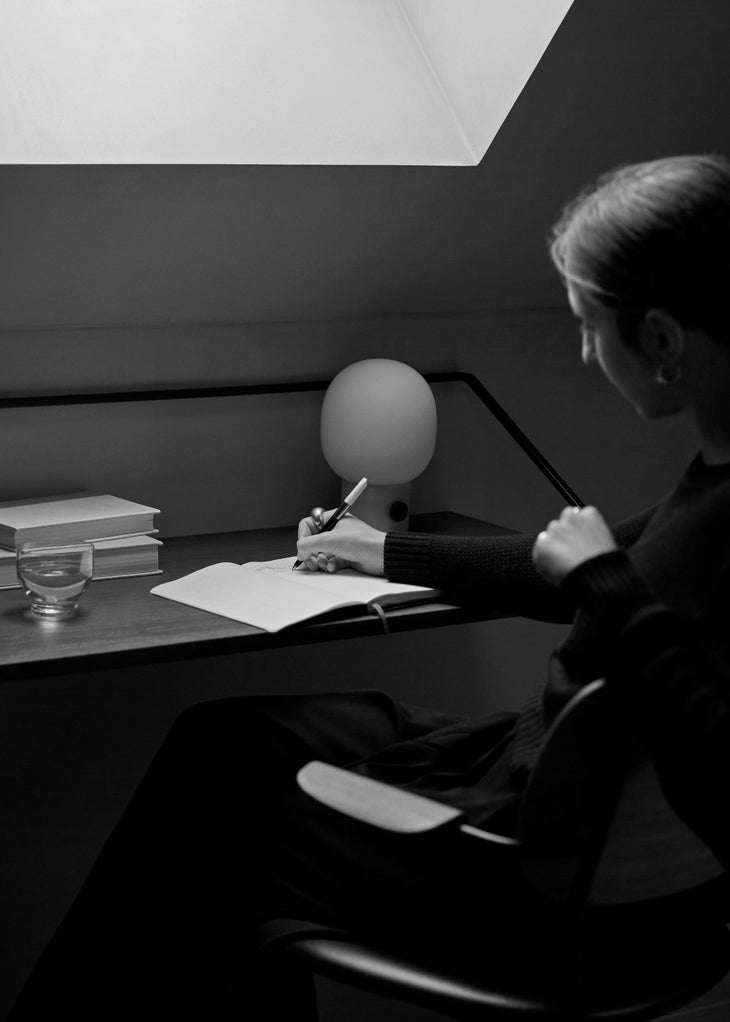 CO green armchair with chrome base