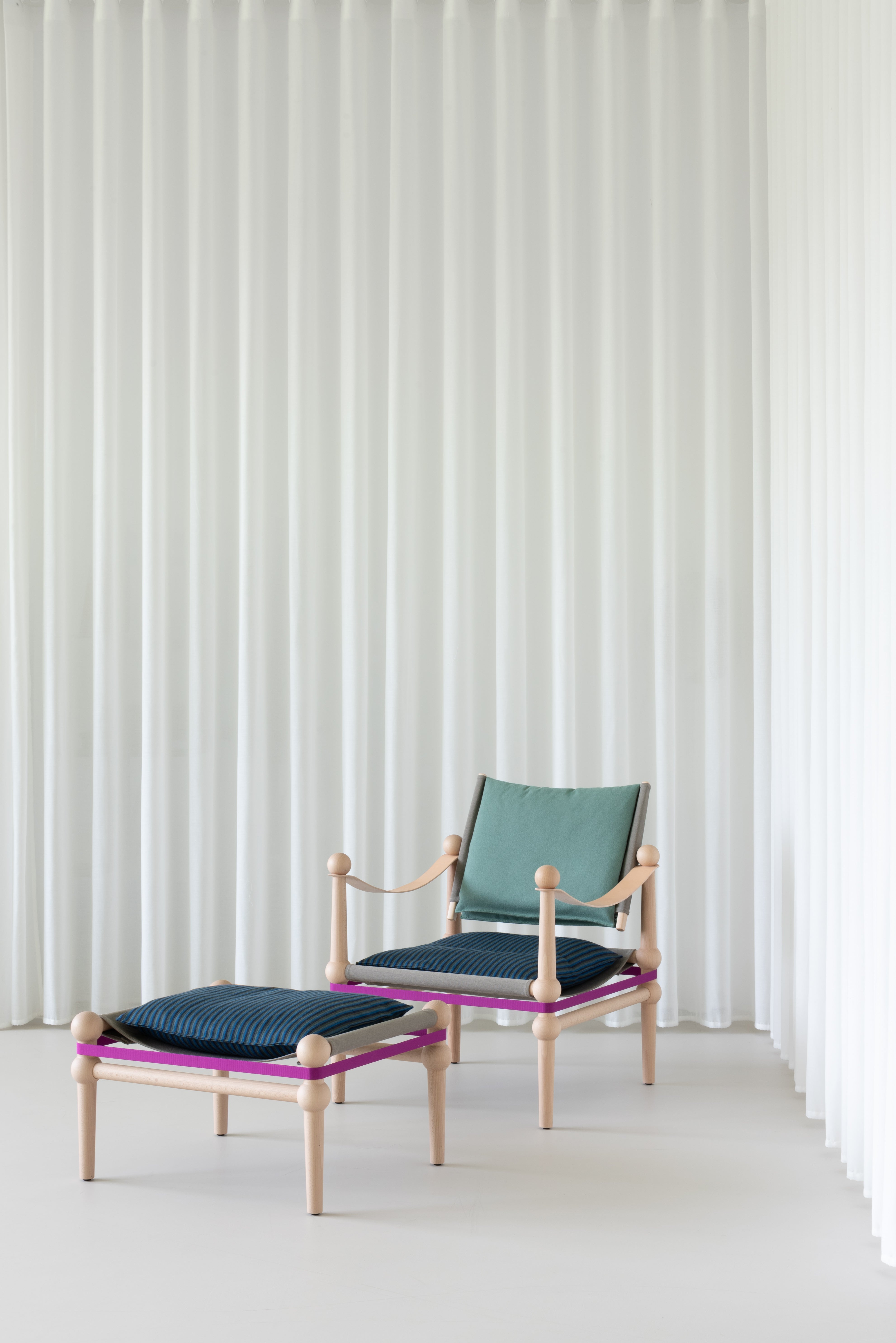 TWAIN ottoman customized with a black beech base