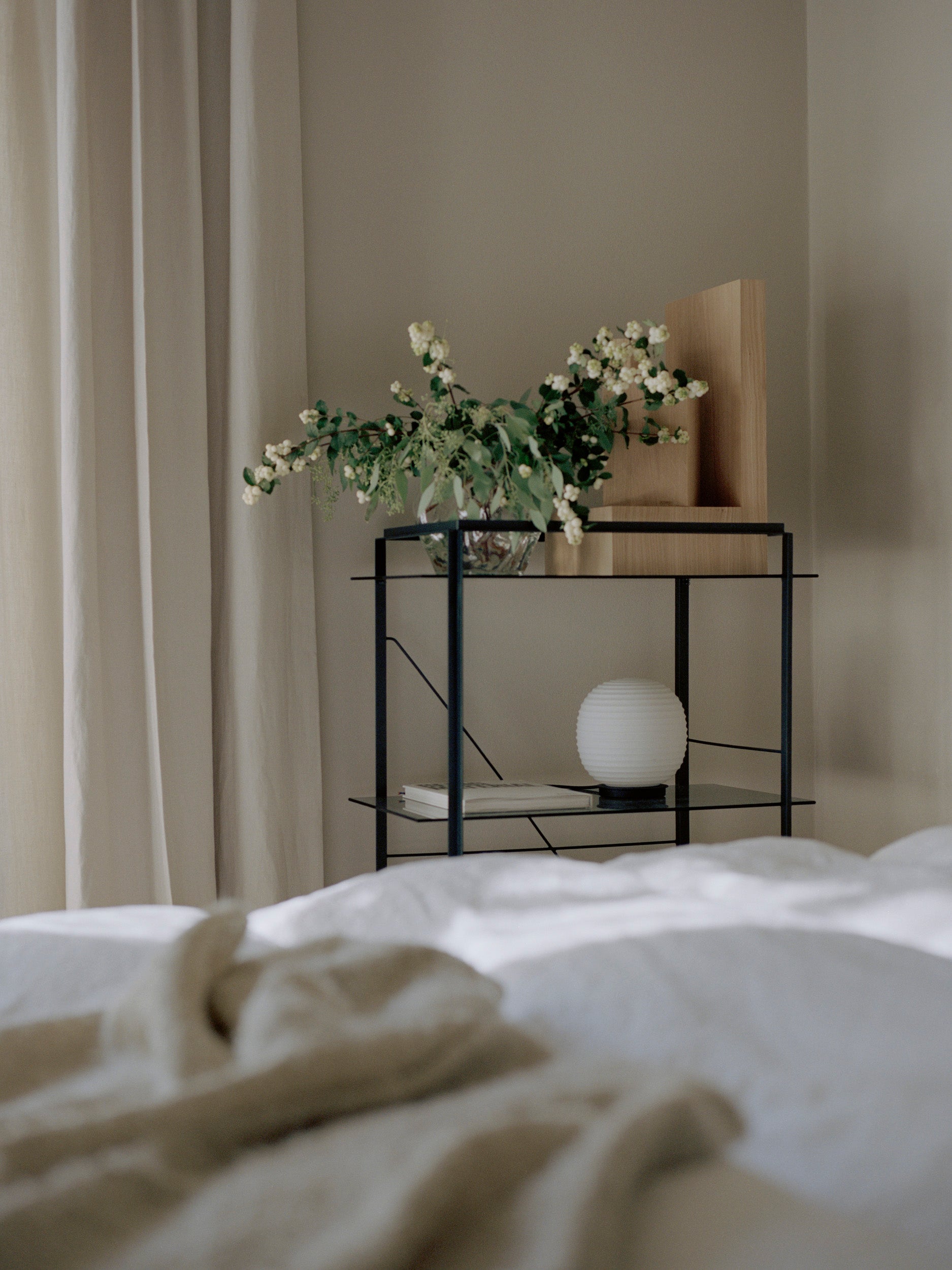 Lantern Globe white table lamp with a black base