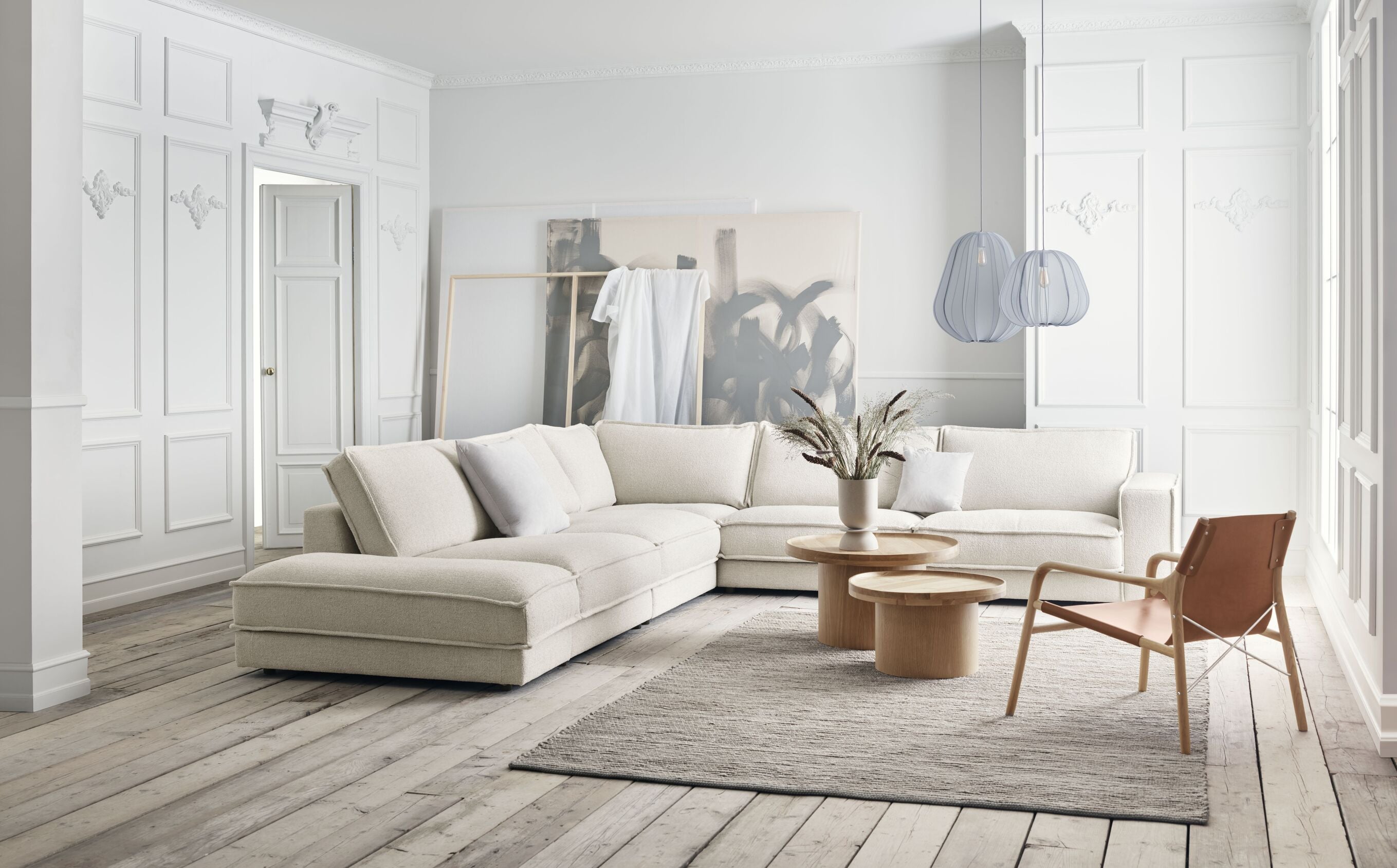 Symetrický 3-modulový čalúnený rohový gauč NOORA s čiernym podstavcom