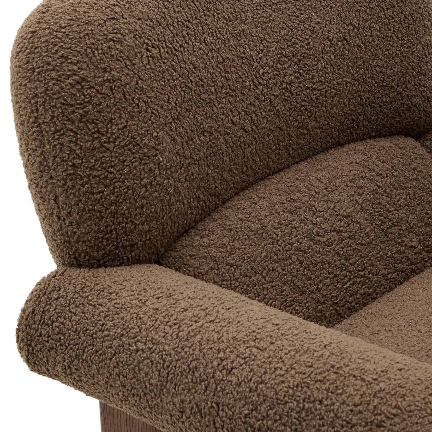 NEMA armchair in brown boucle with a dark ash base