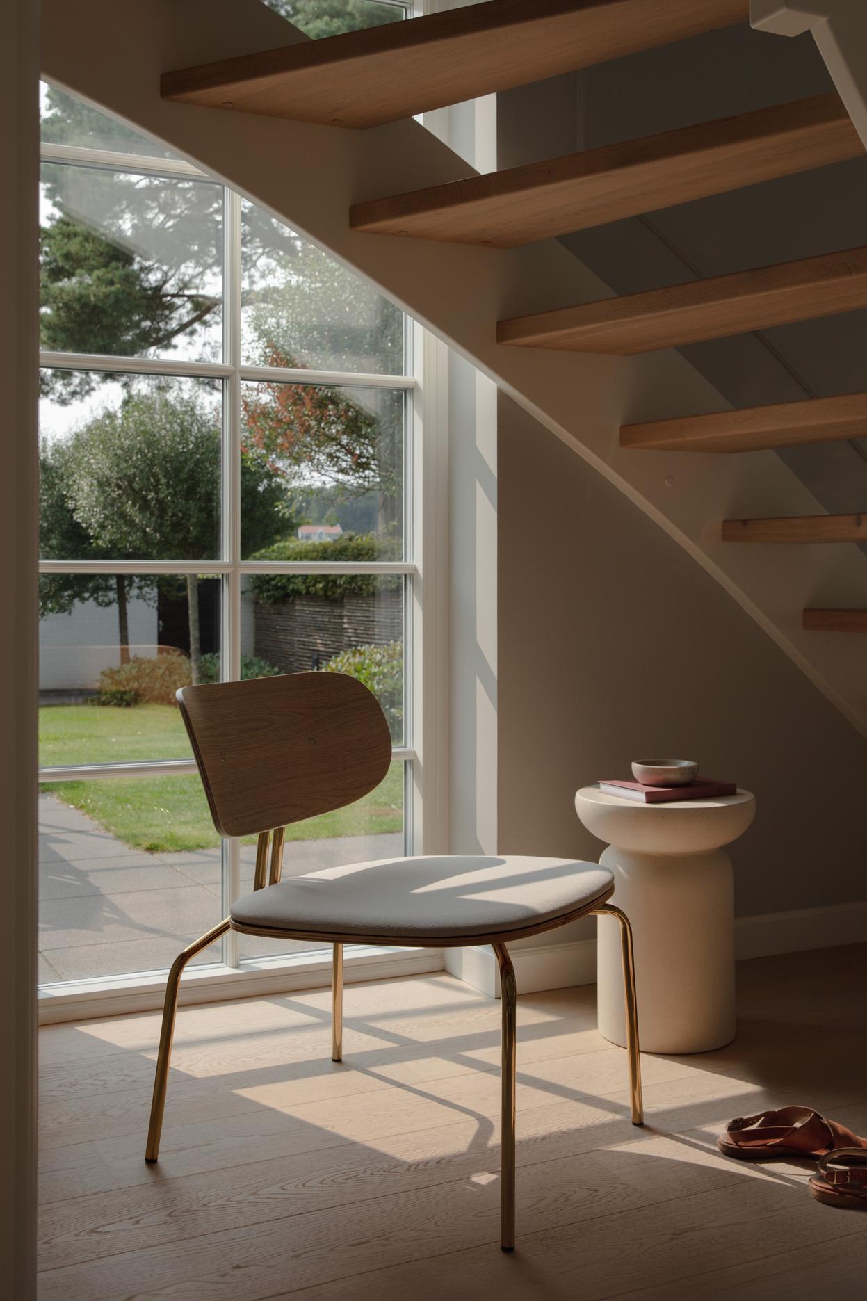 Curious chair cream plush with a black base