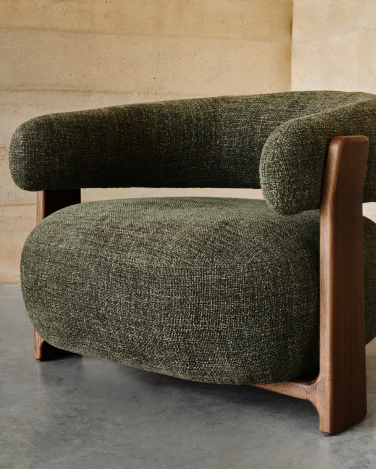 GRANITE green armchair with a dark ash base