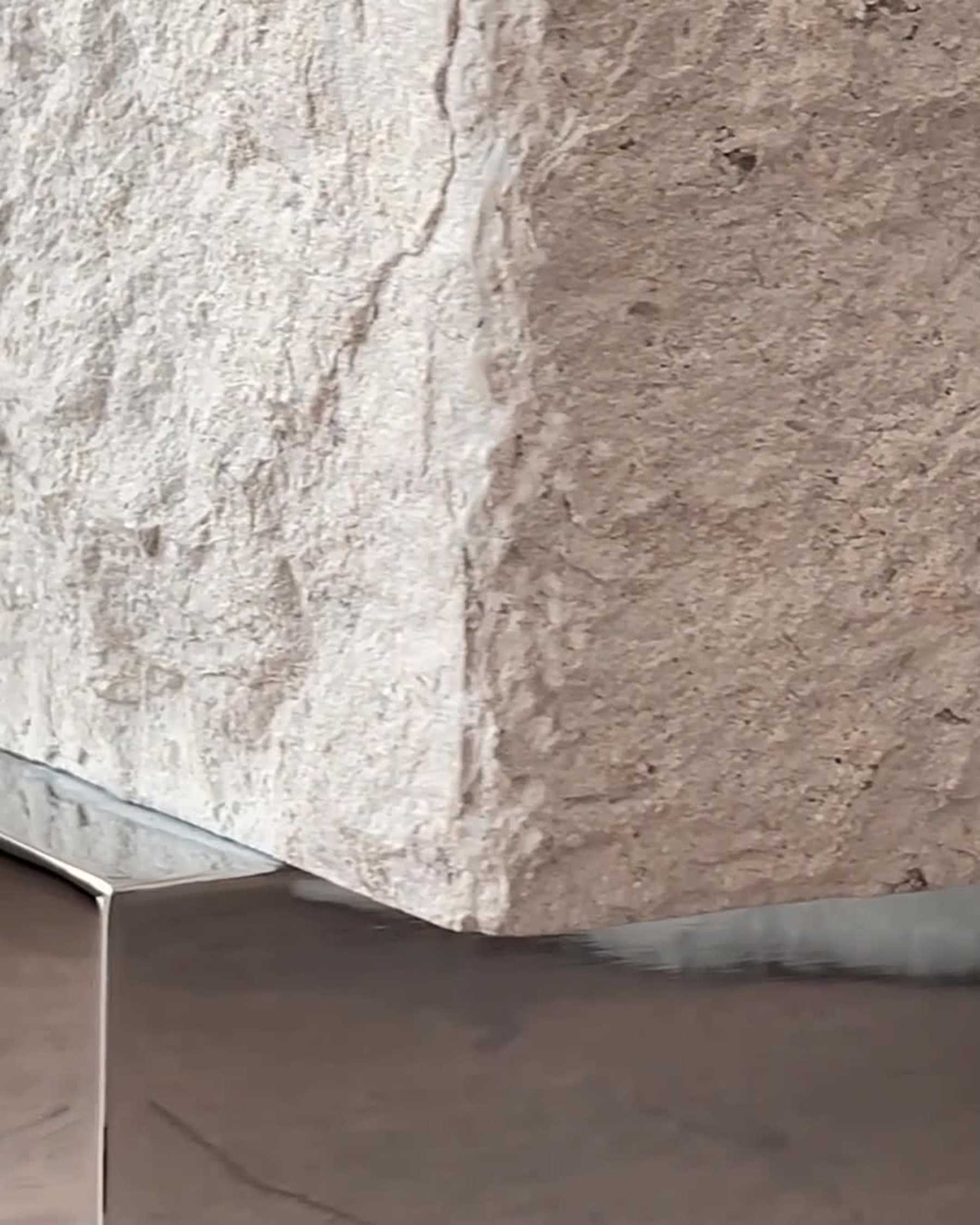 TEMPLE limestone coffee table with a silver base