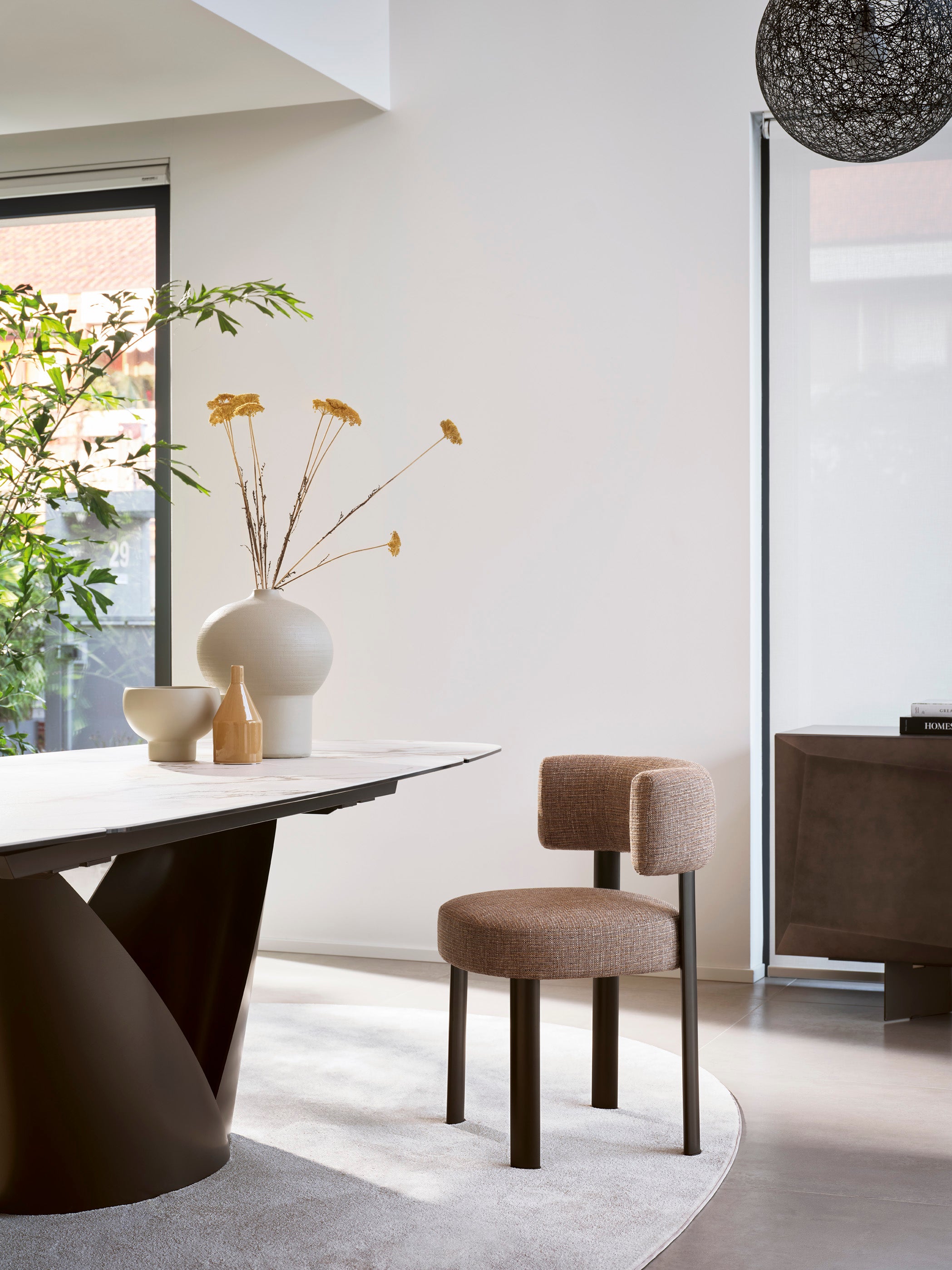 Upholstered GLEN chair with a brown base