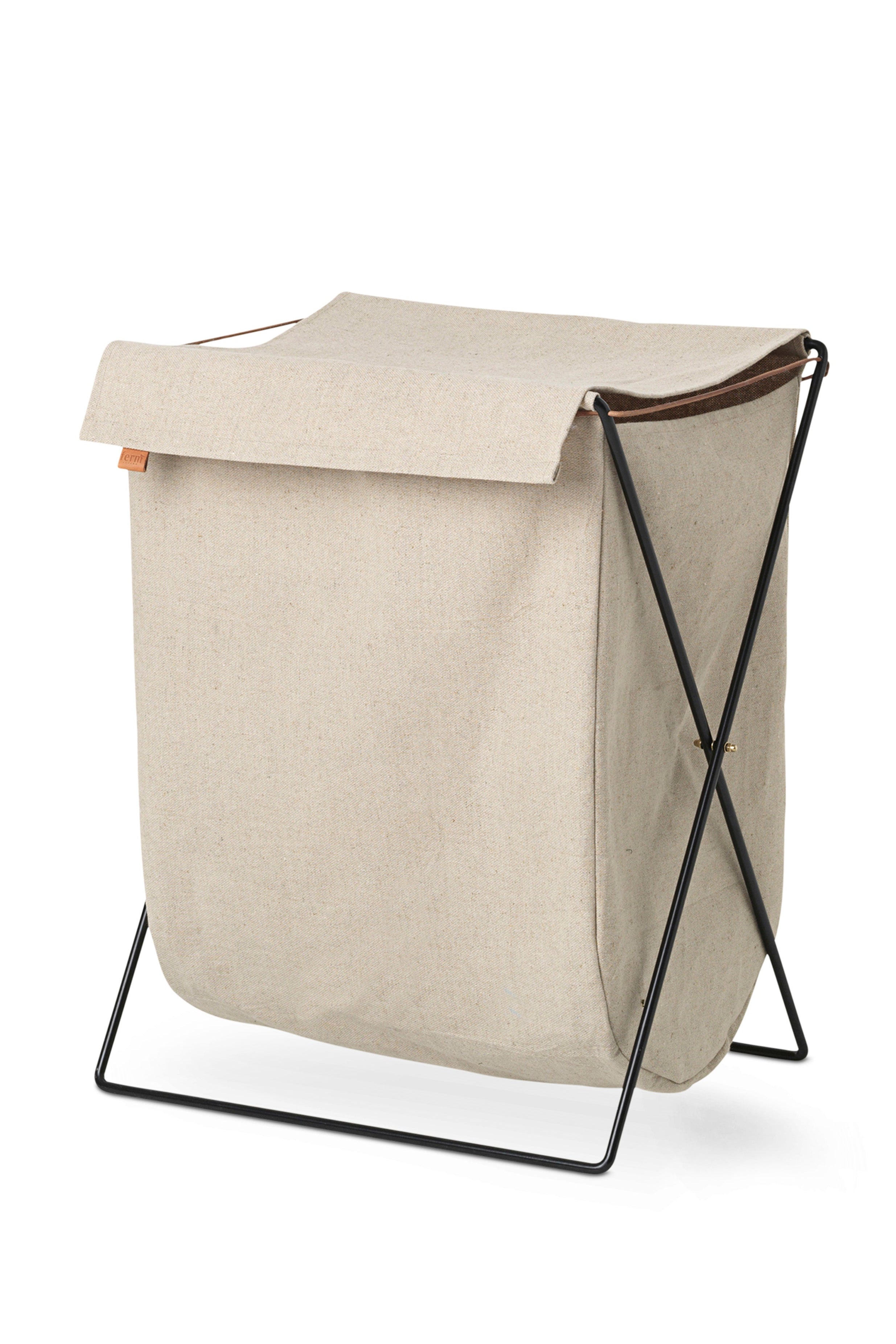 HERMAN beige laundry basket with a black base