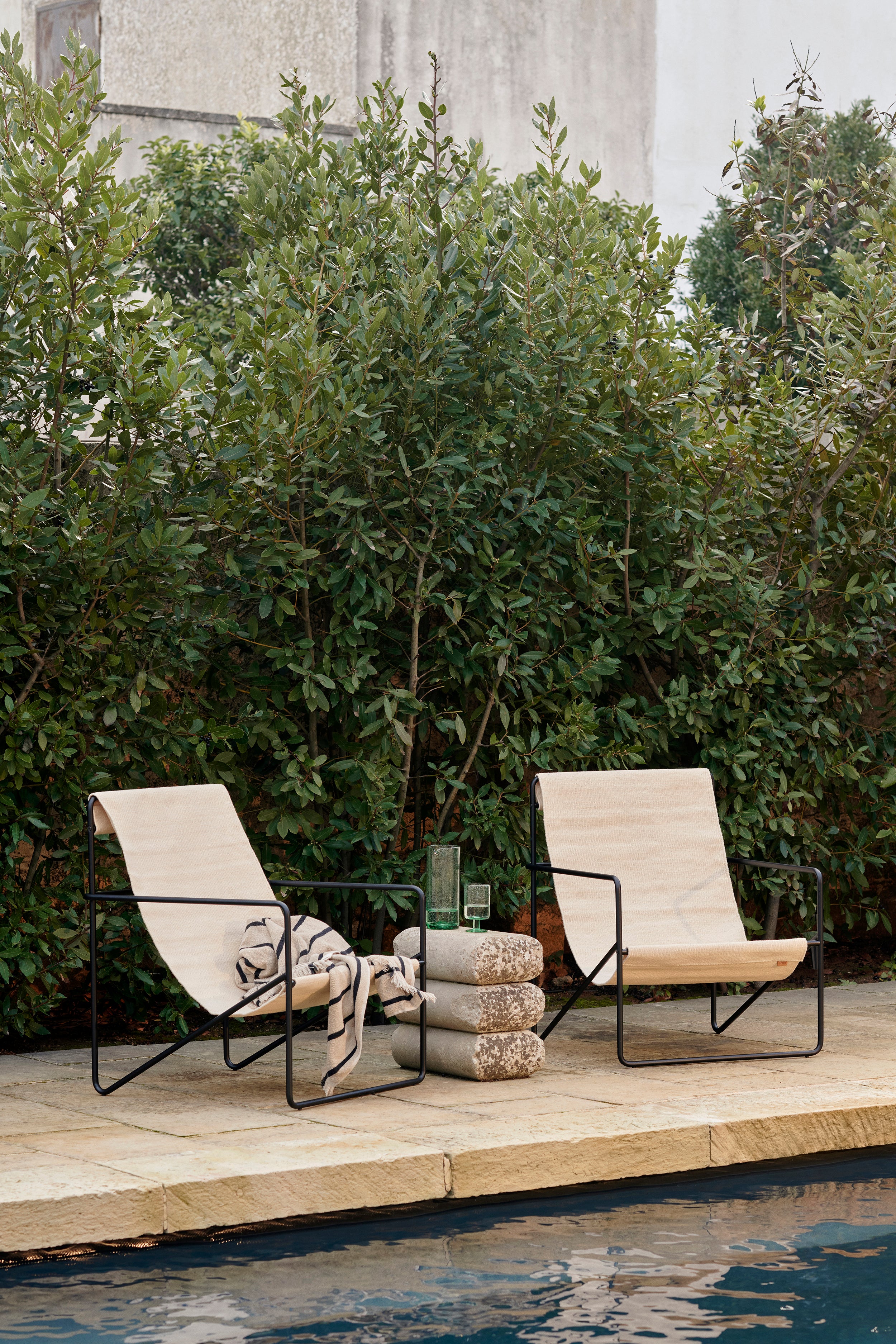 Desert beige garden armchair with a black base