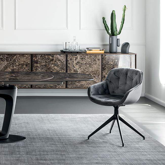 IGLOO upholstered quilted swivel chair with black base