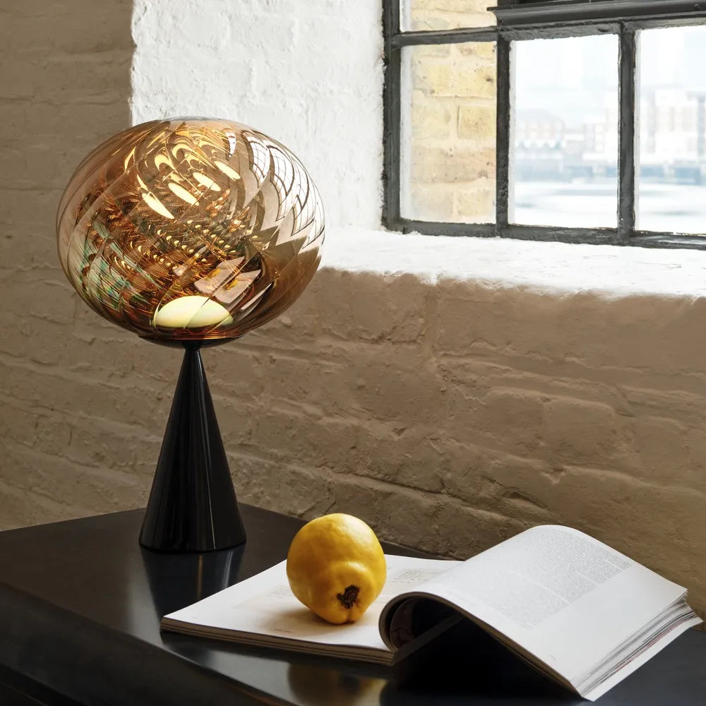 WHIRL table lamp in gold with a black base