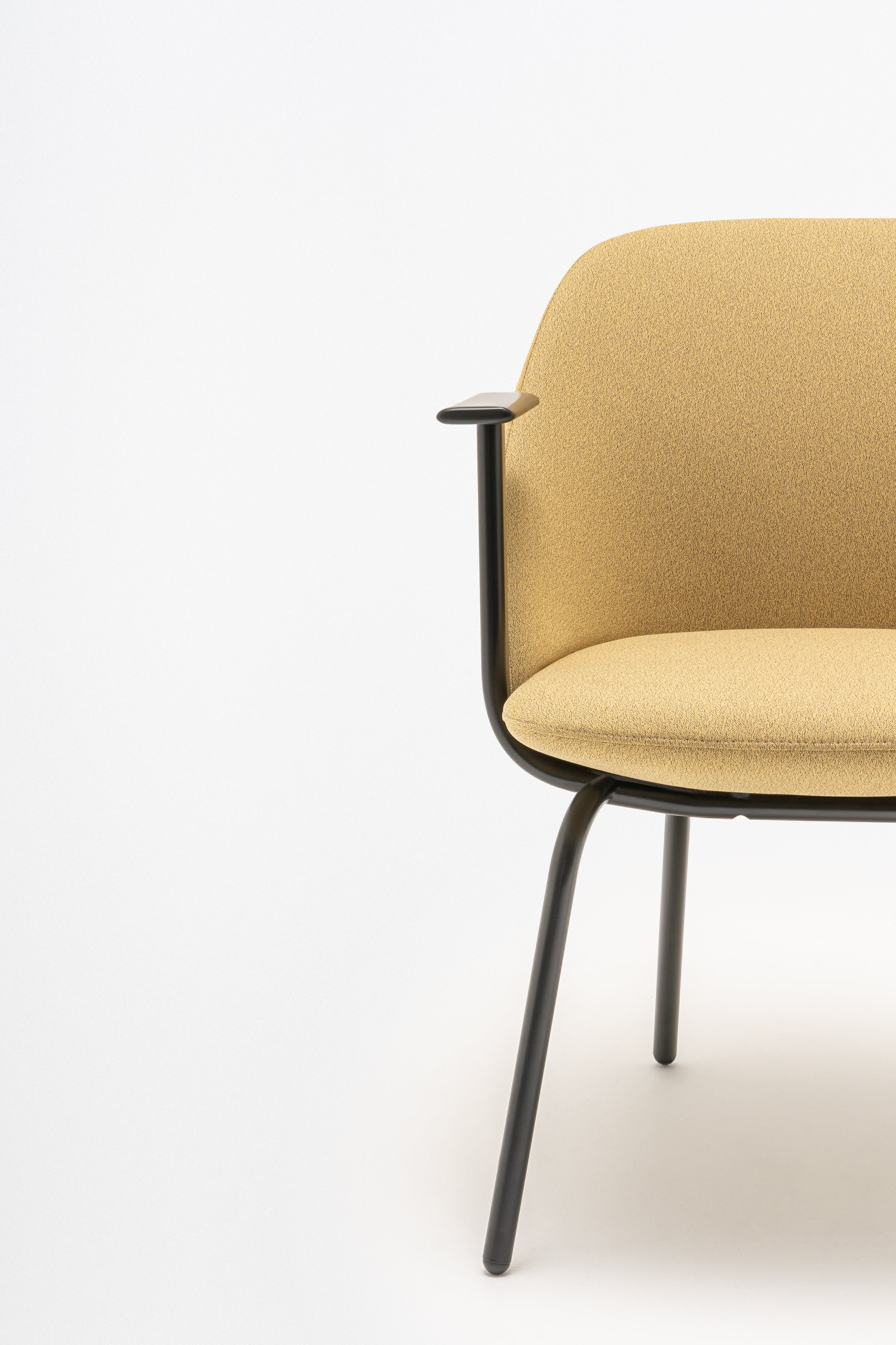 Armchair with low backrest parallel four -legged base