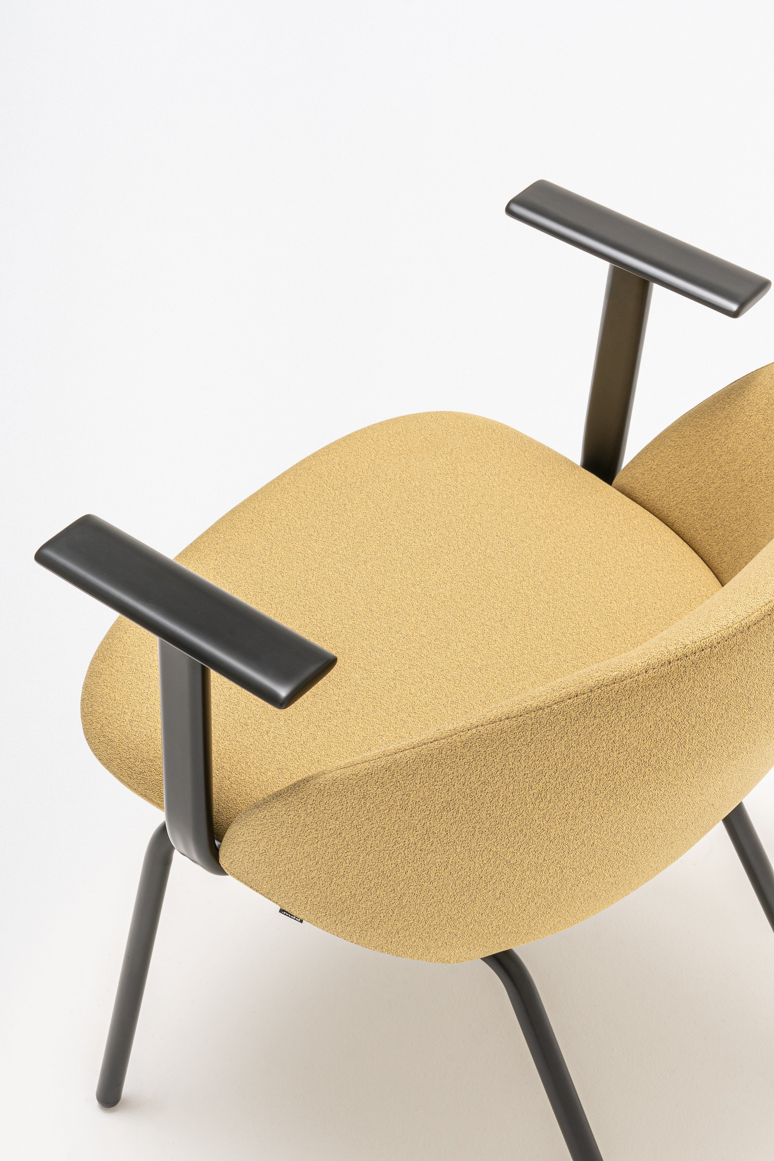 Armchair with low backrest parallel four -legged base