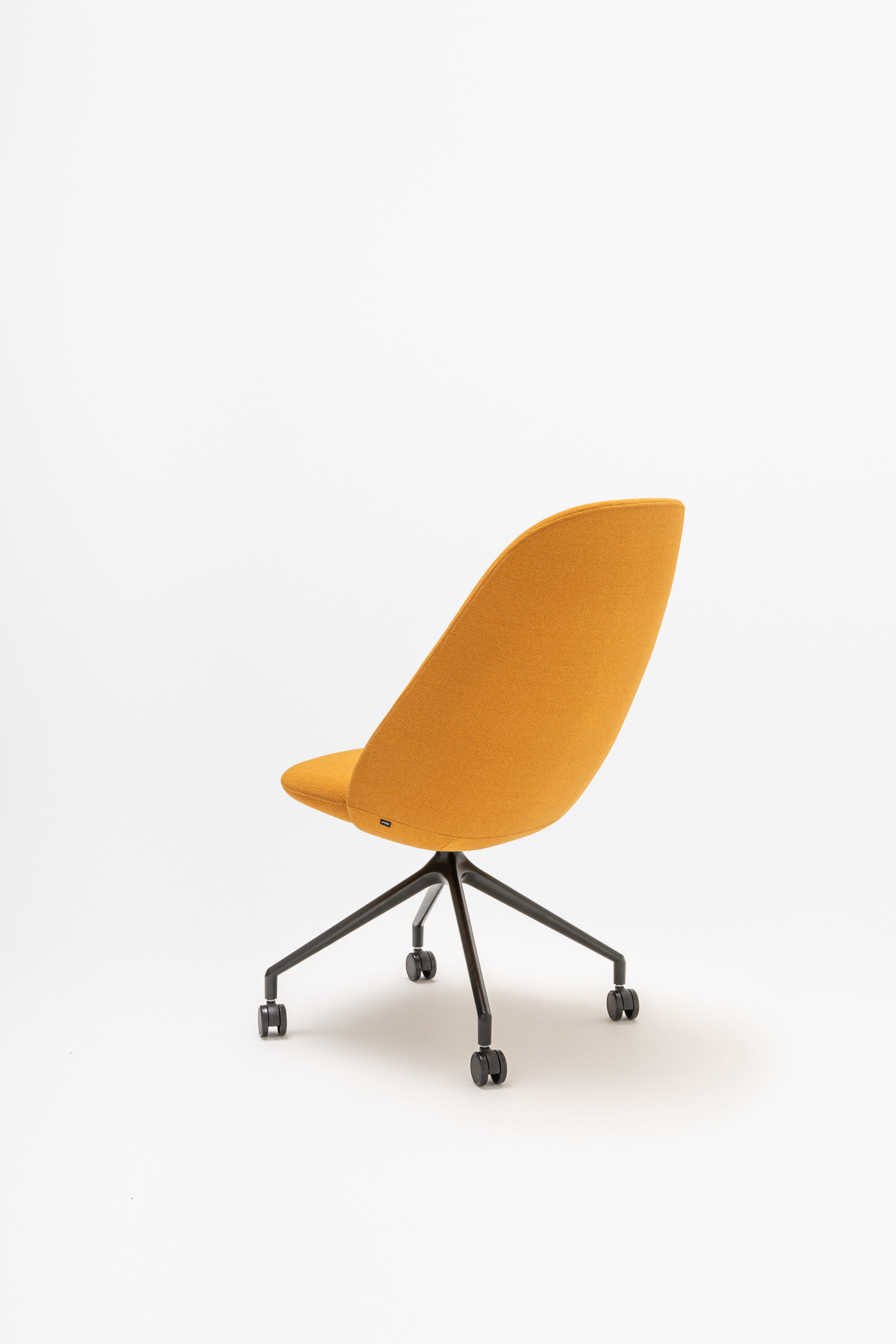 Rotable armchair with a high back, a metal parallel base with wheels to a soft surface