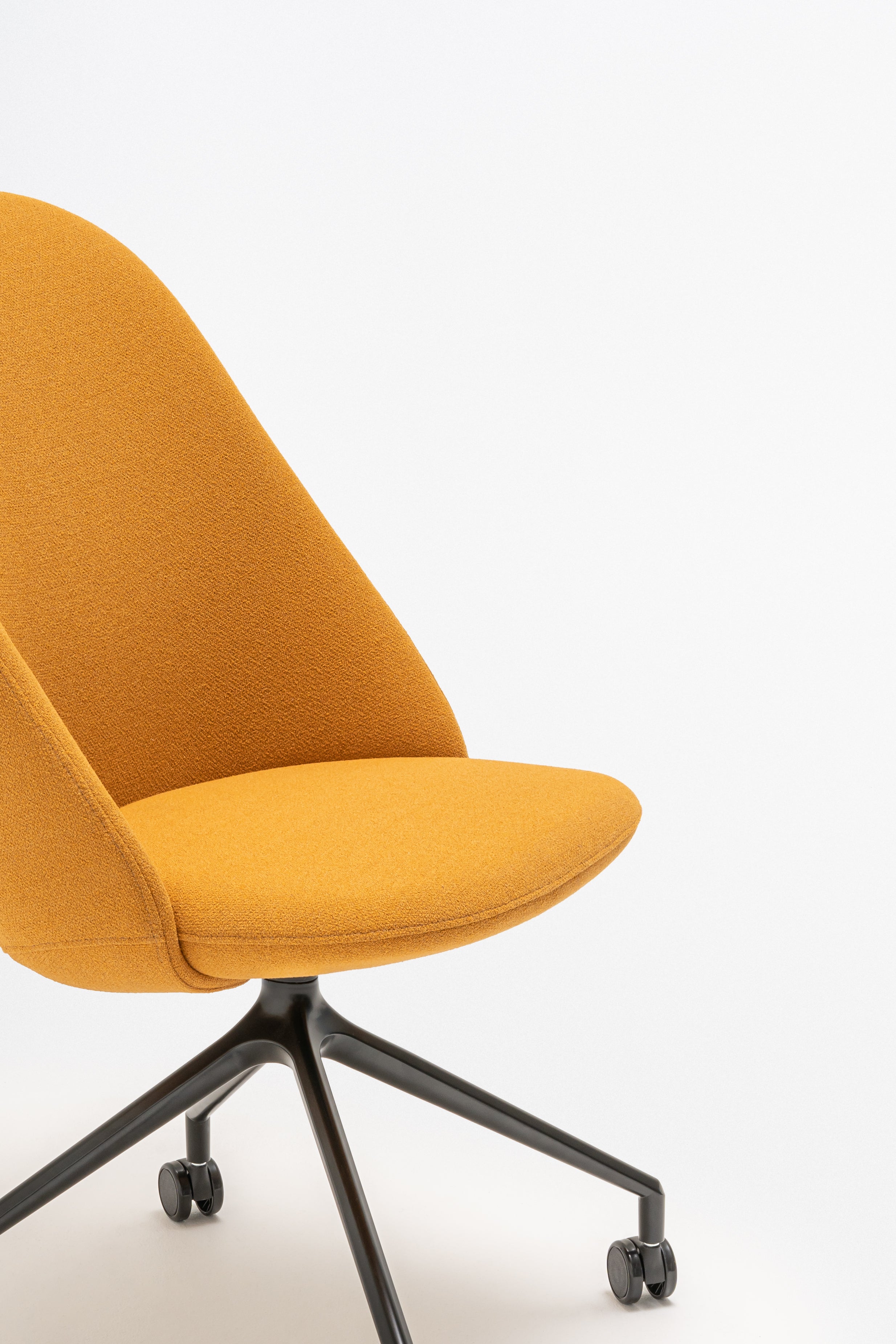 Rotable armchair with a high back, a metal parallel base with wheels to a soft surface