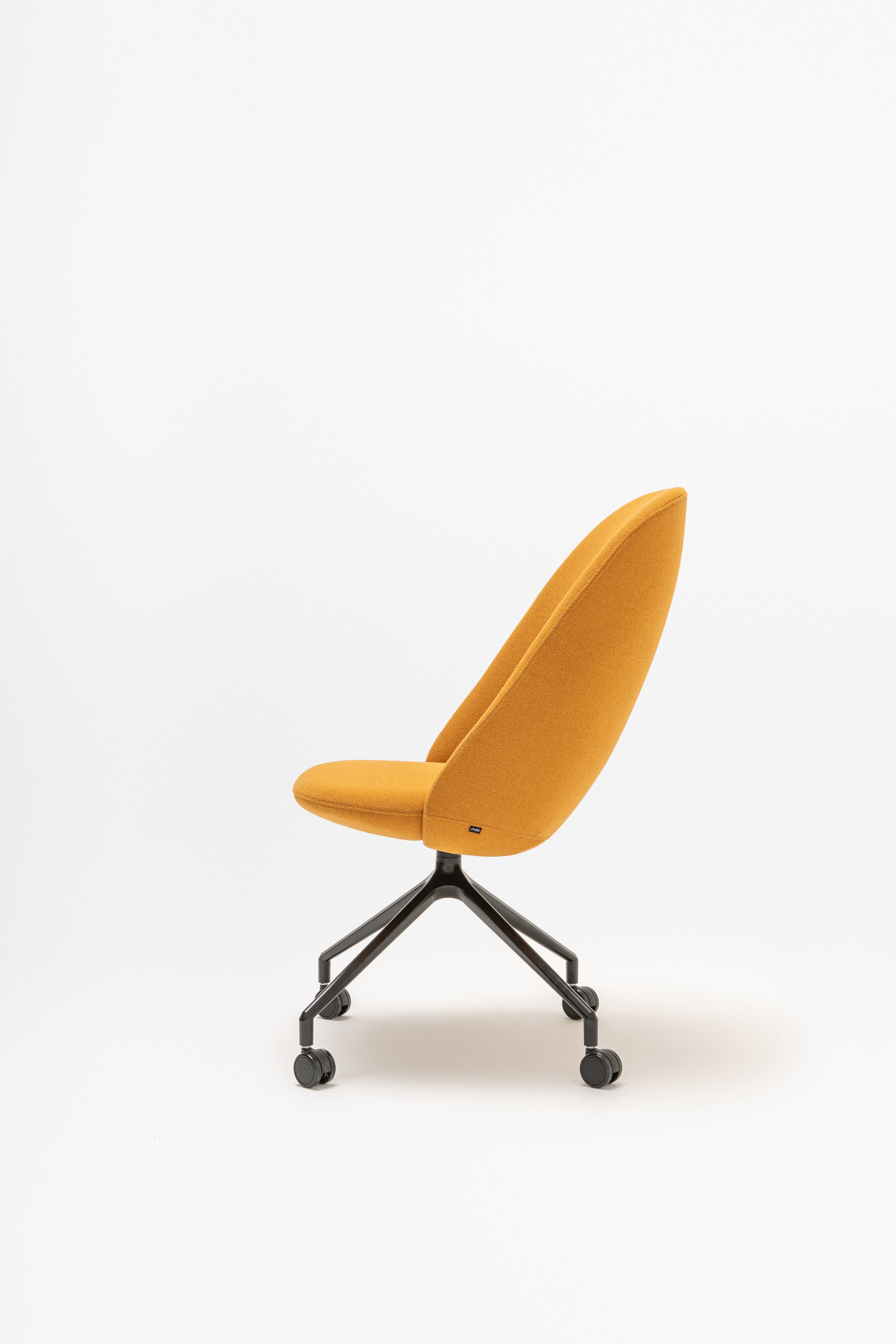 Rotable armchair with a high back, a metal parallel base with wheels to a soft surface
