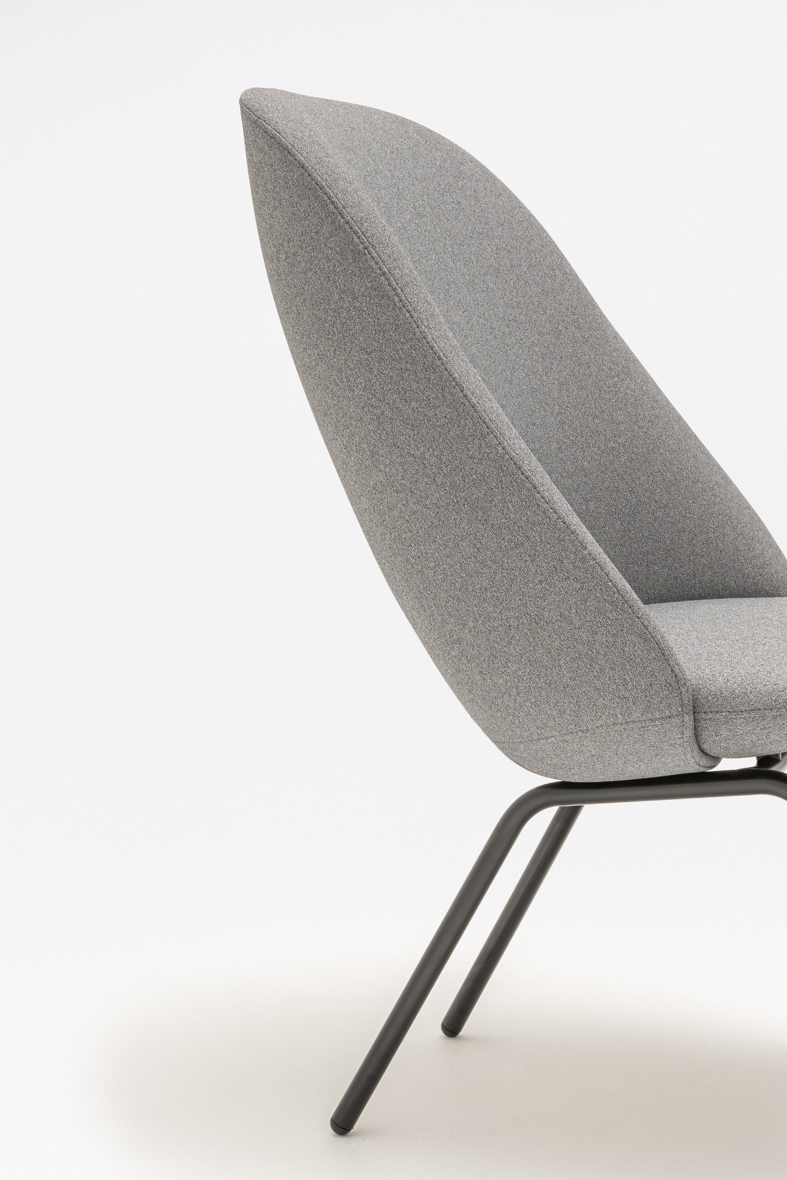 Armchair with high back parallel four -legged base