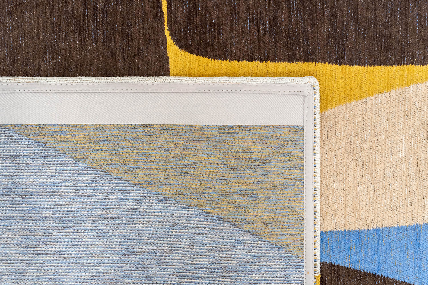 STONES rug in white with brown and blue