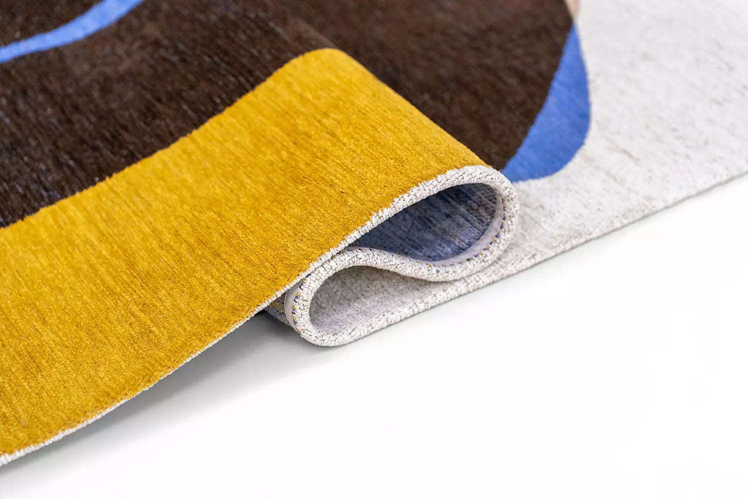 STONES rug in white with brown and blue