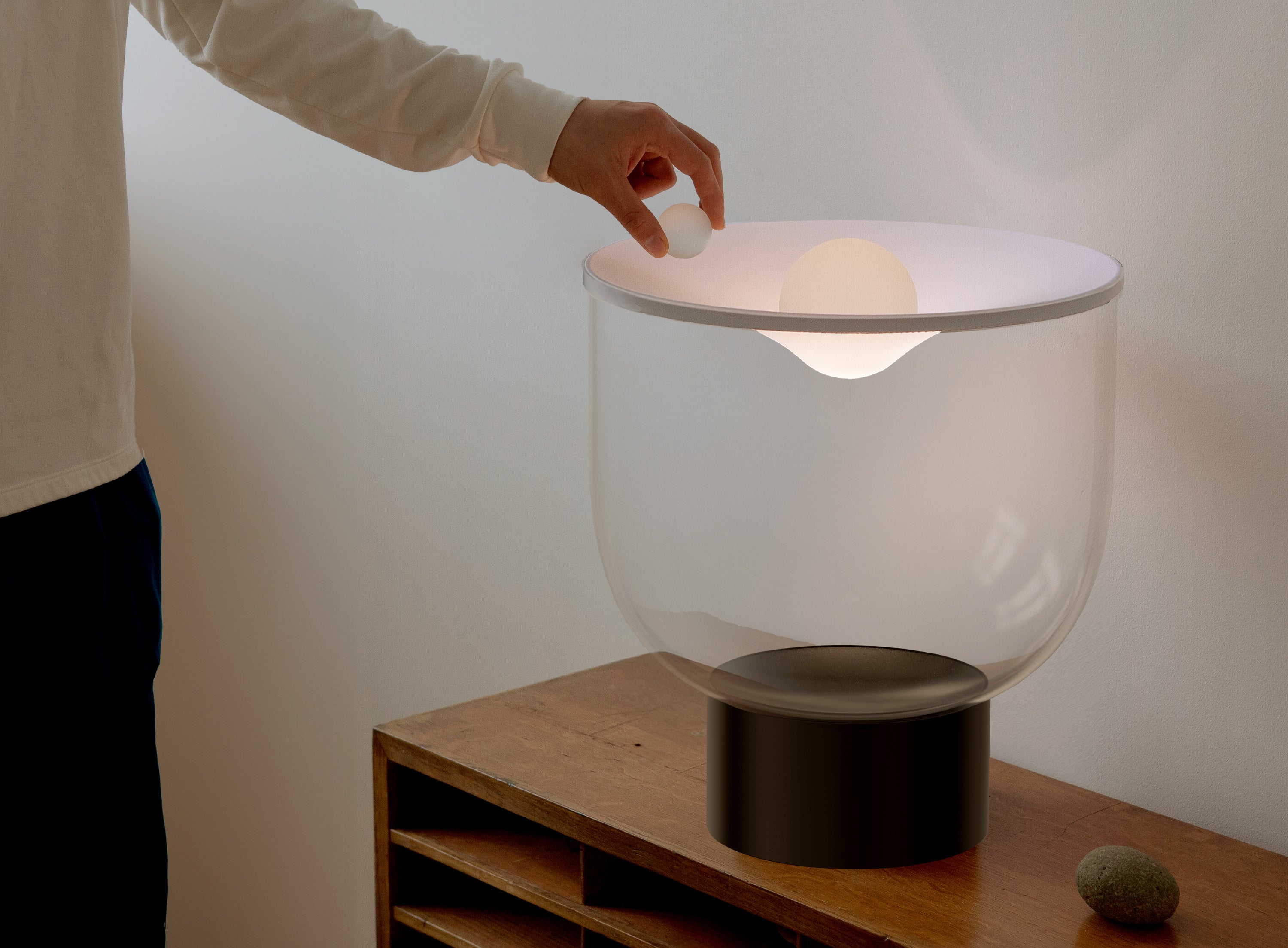GRAMMOLUCE table lamp with a glass shade and black base.