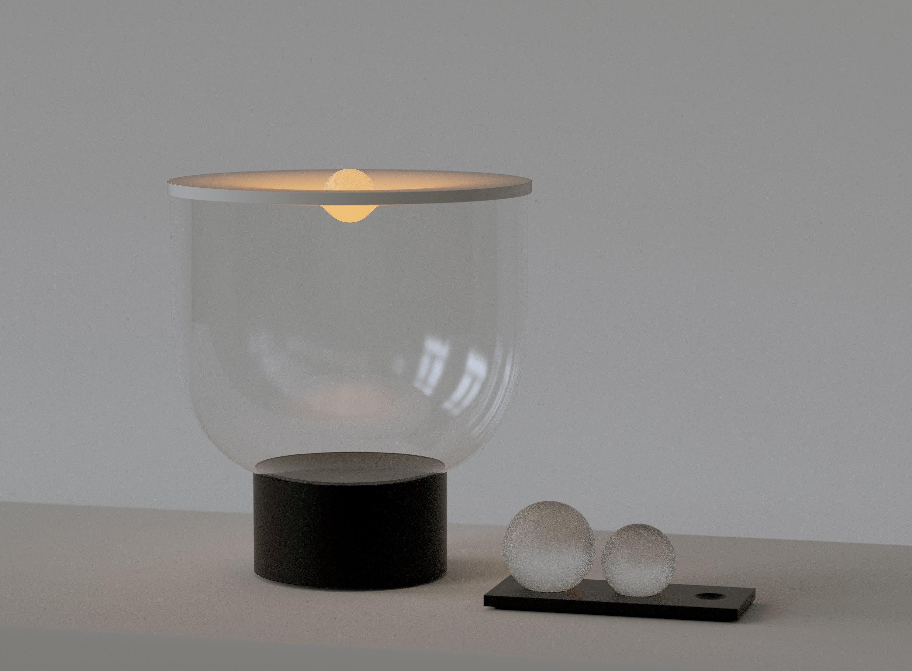 GRAMMOLUCE table lamp with a glass shade and black base.
