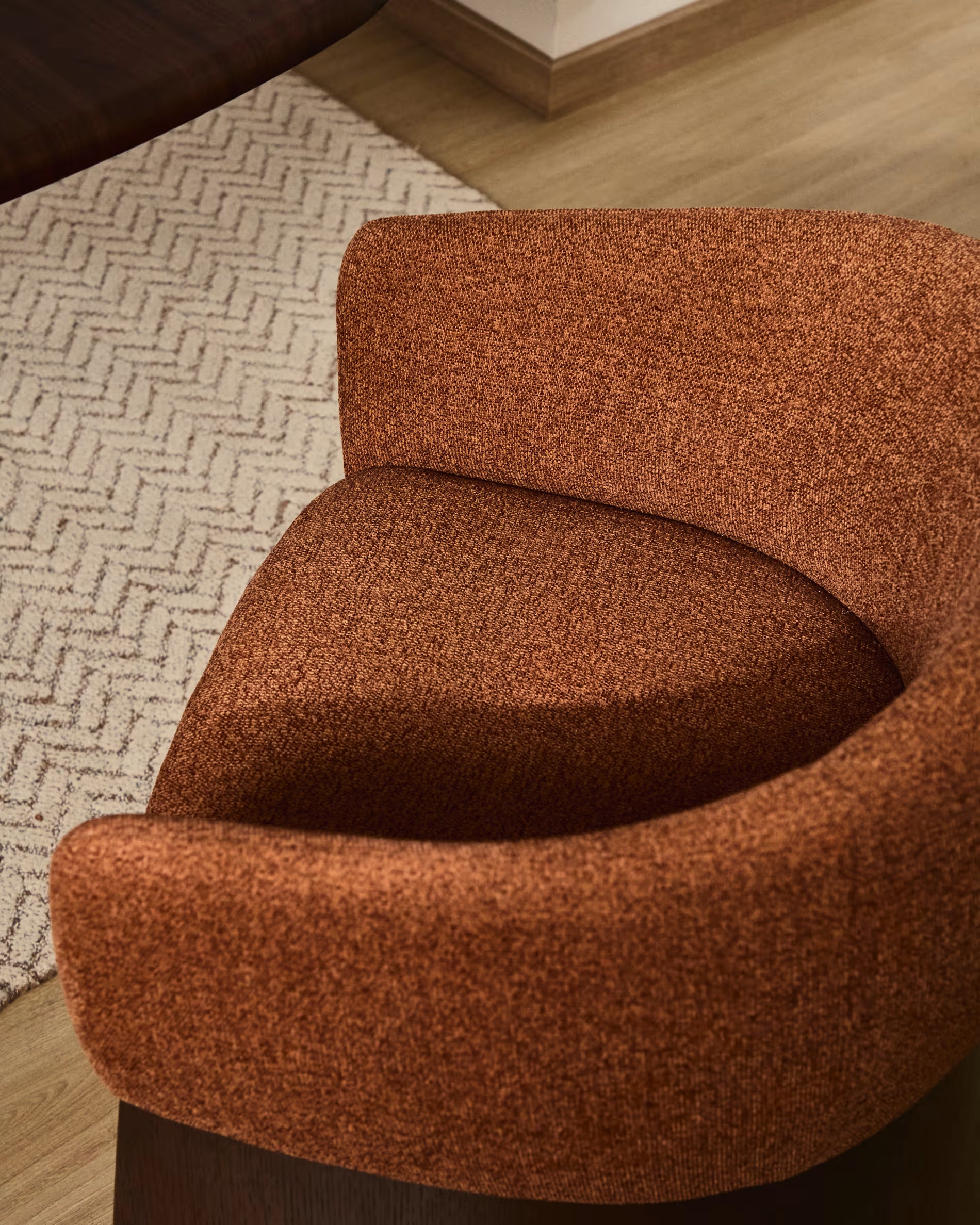 BOSCA chair in brick-colored chenille with a walnut veneer base