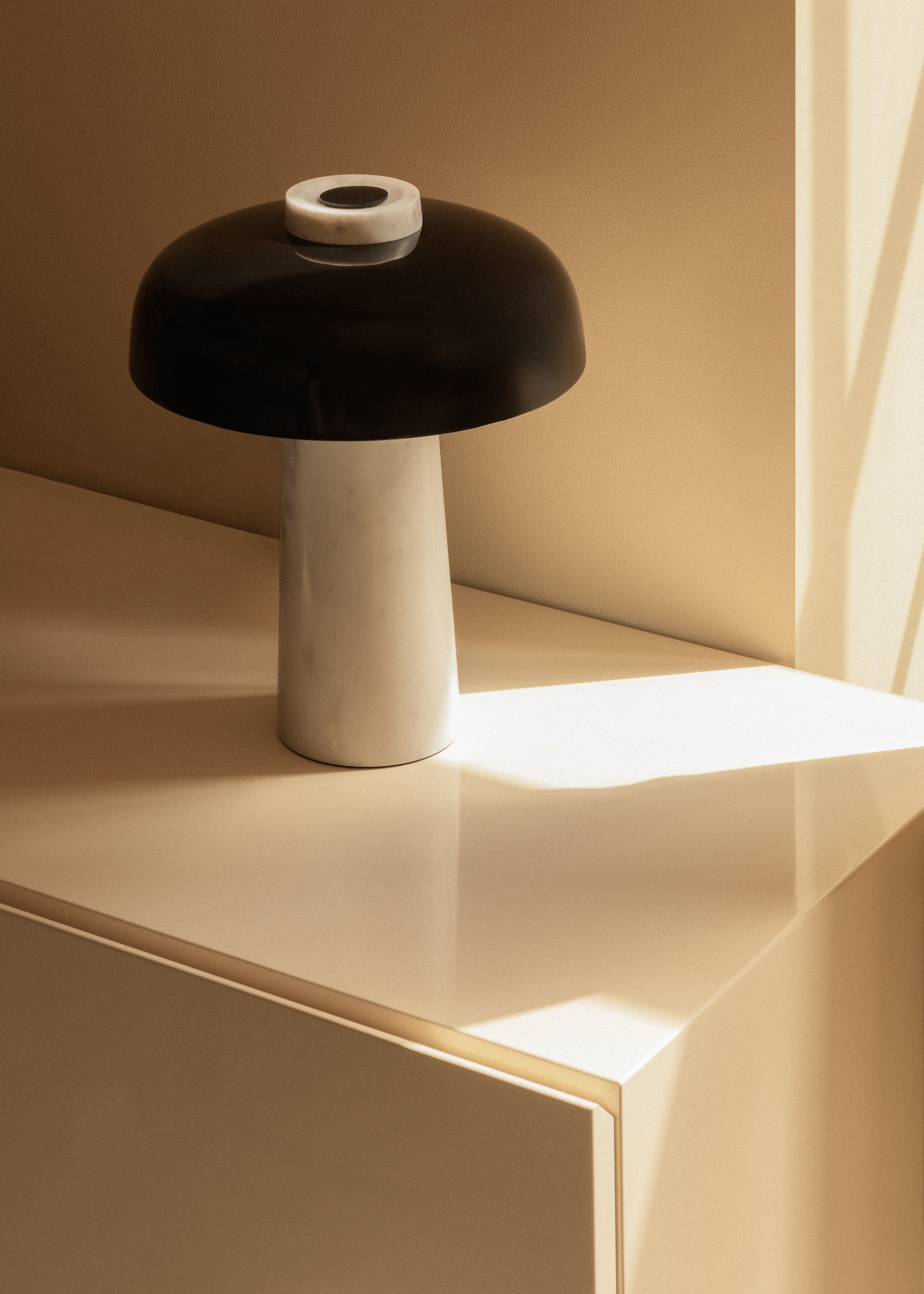 REVERSE table lamp with a brown shade and a stone base