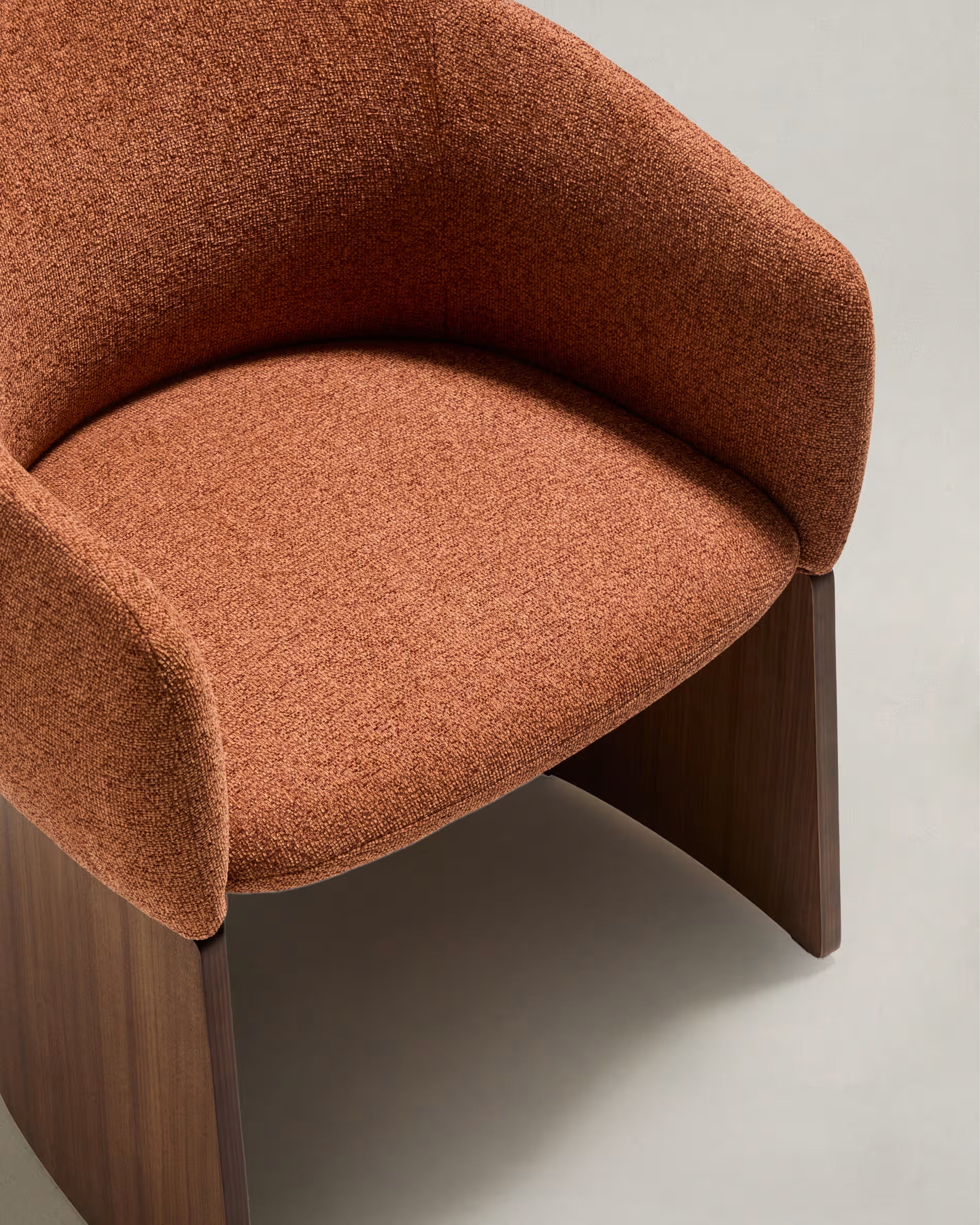BOSCA chair in brick-colored chenille with a walnut veneer base