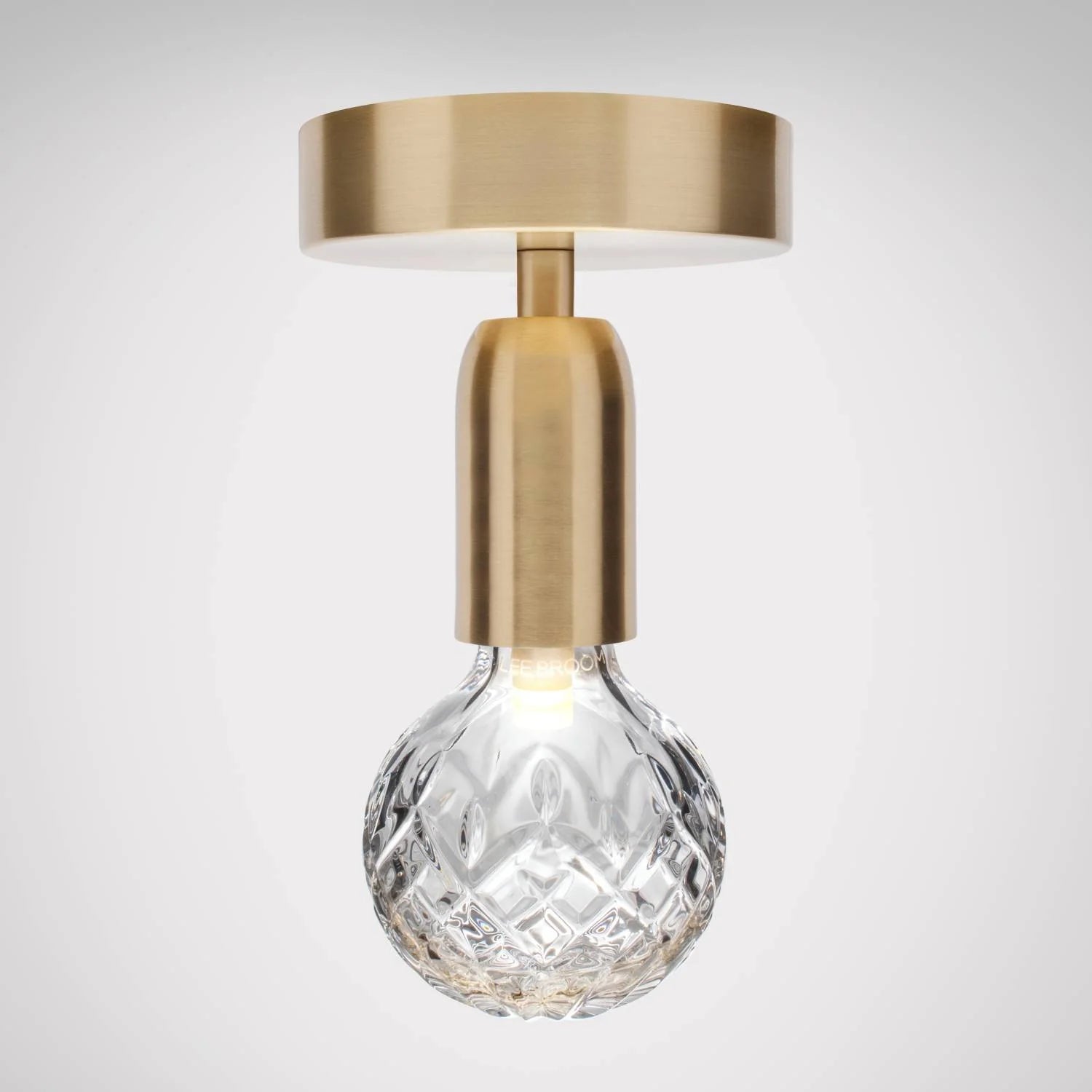 Lusterko CRYSTAL BULB so skleneným kryštálom a mosadzným povrchom.
