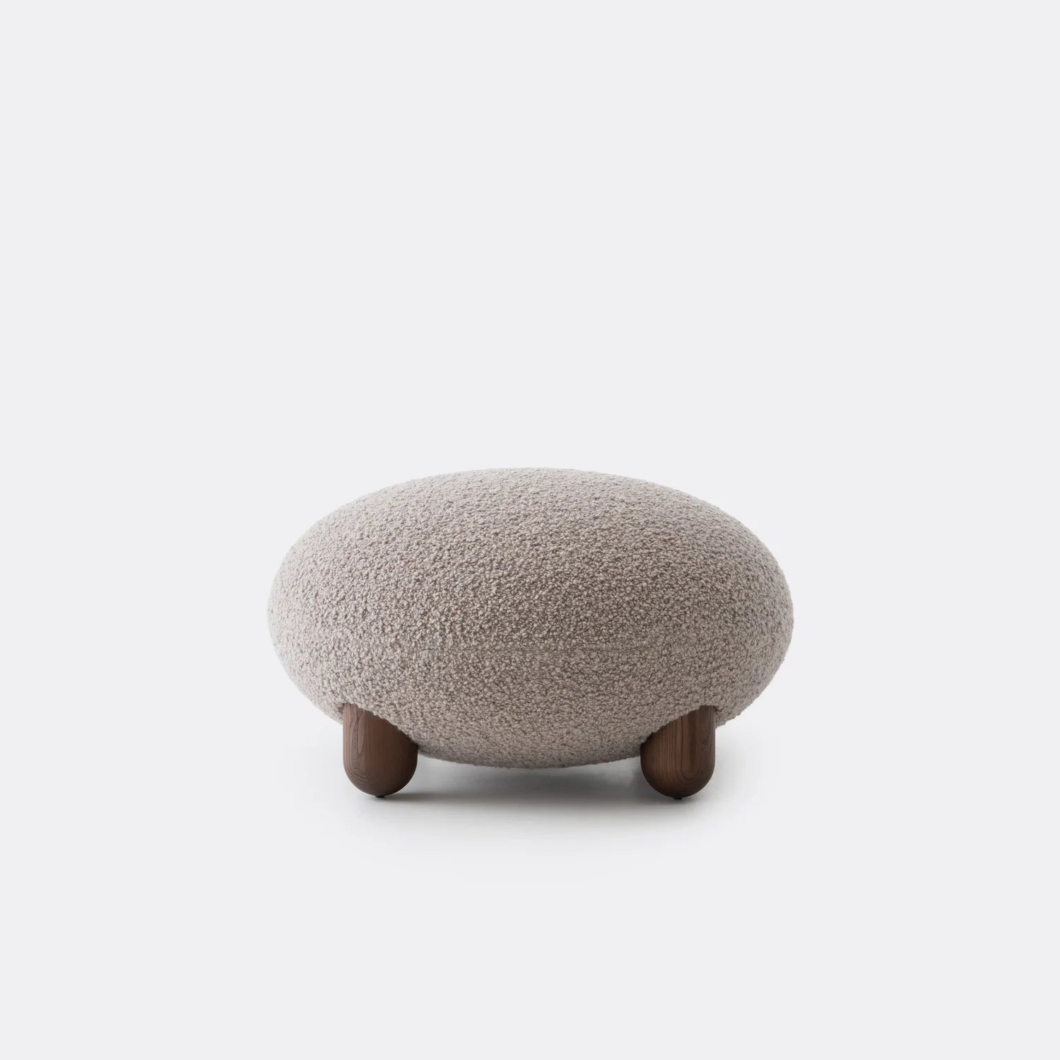 Upholstered pouf with wooden base
