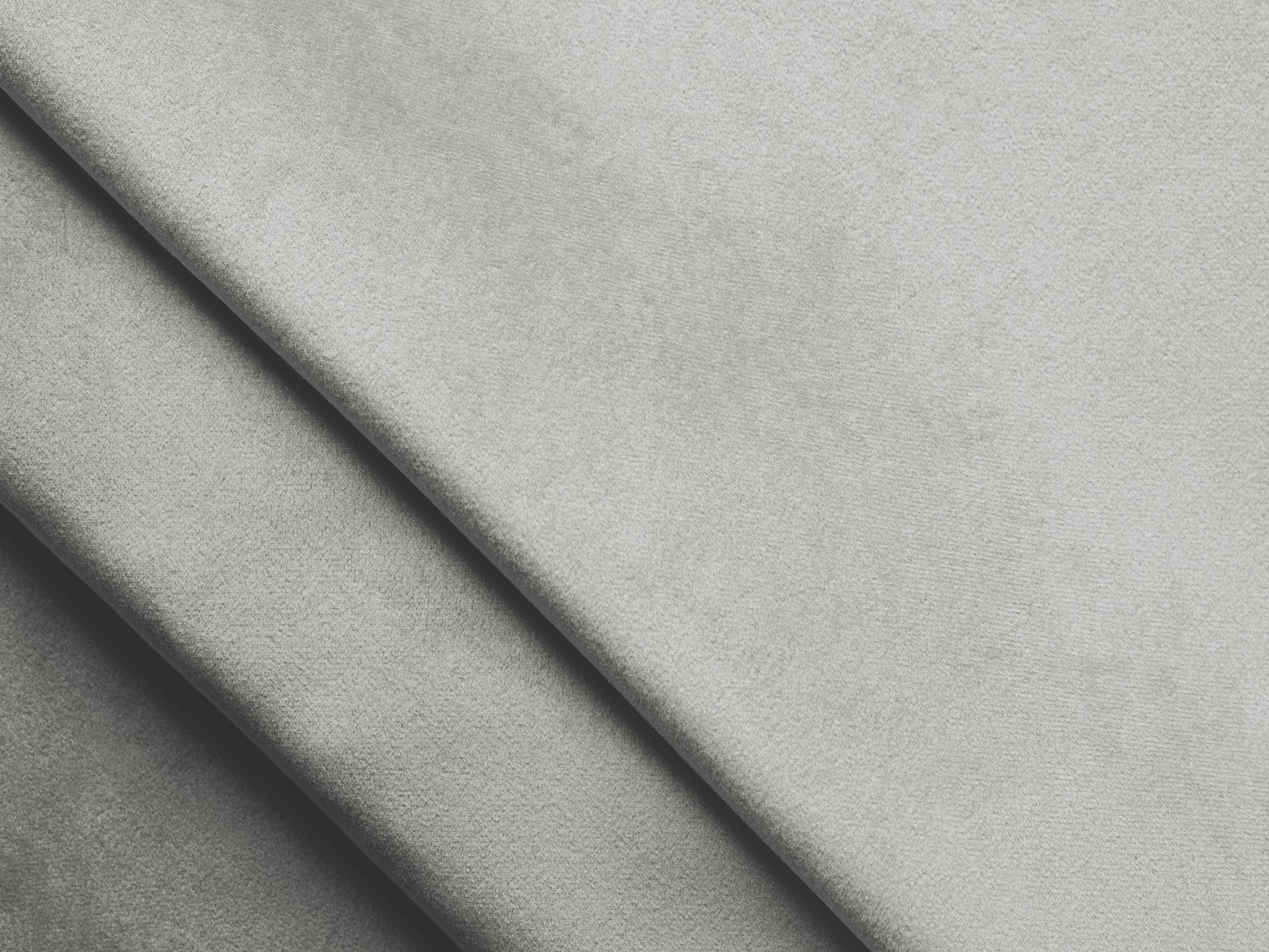 Sivý strieborný pravostranný sametový rohový gauč s funkciou spania KONA