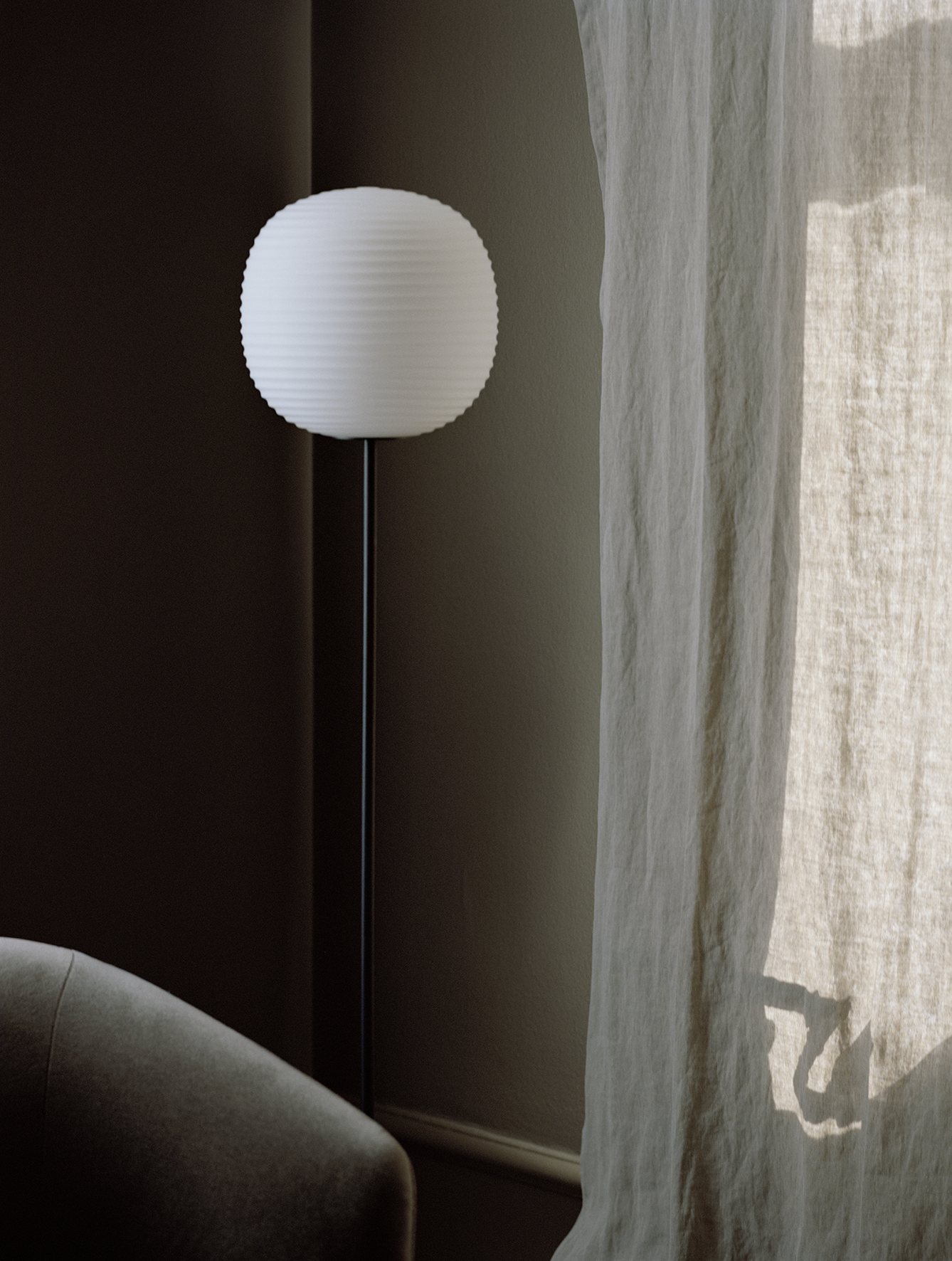 Lantern white floor lamp with a black base