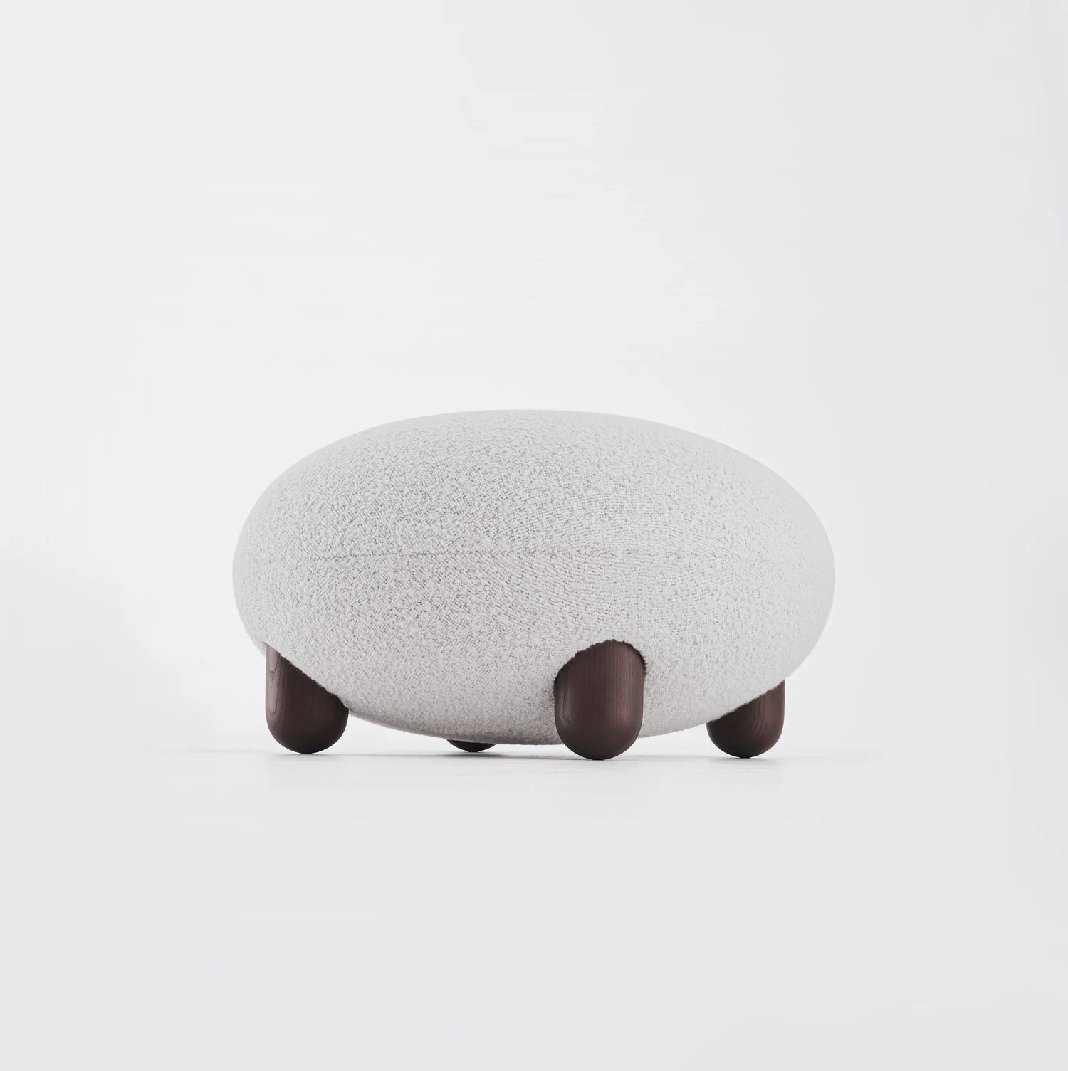 Upholstered pouf with wooden base