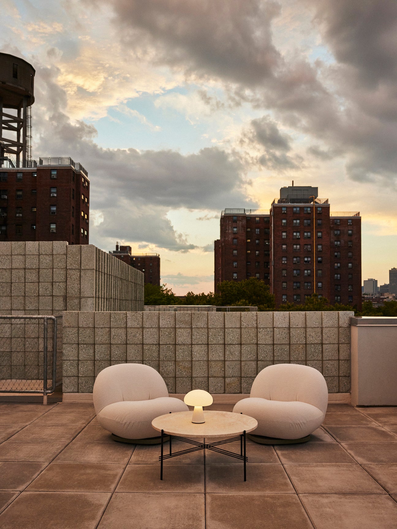 PACHA upholstered outdoor armchair with a gold base