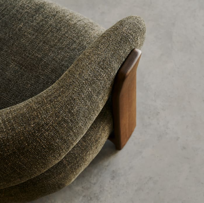 GRANITE green armchair with a dark ash base