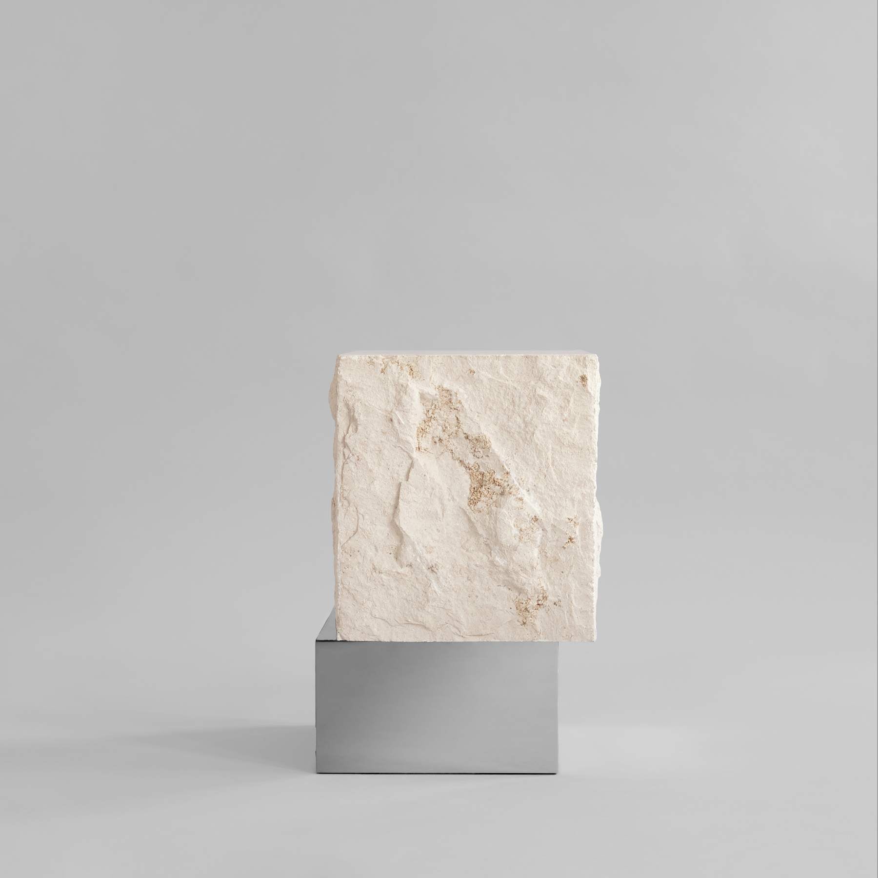 TEMPLE limestone coffee table with a silver base